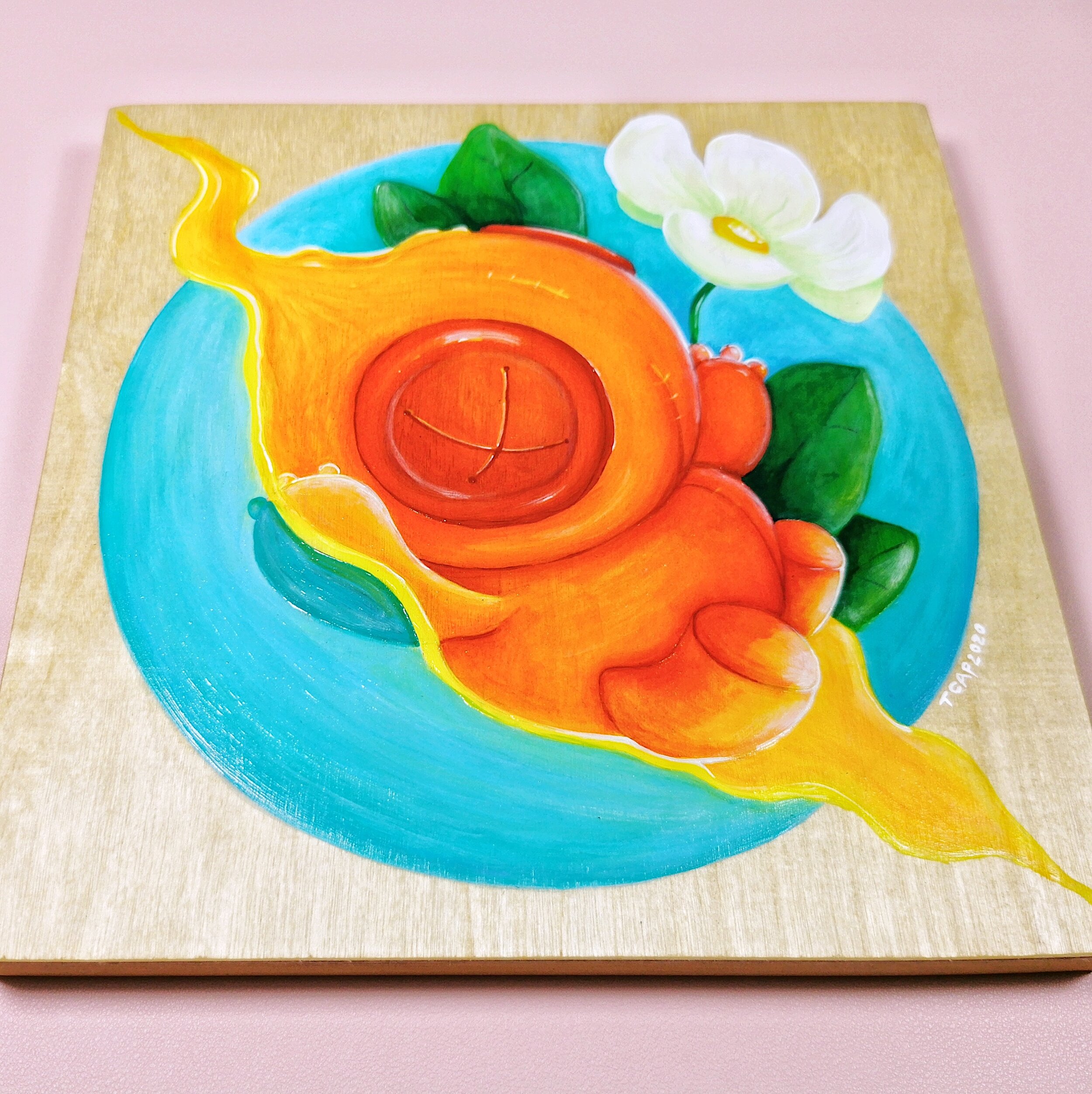 voodoo doll with flower painted on wood panel