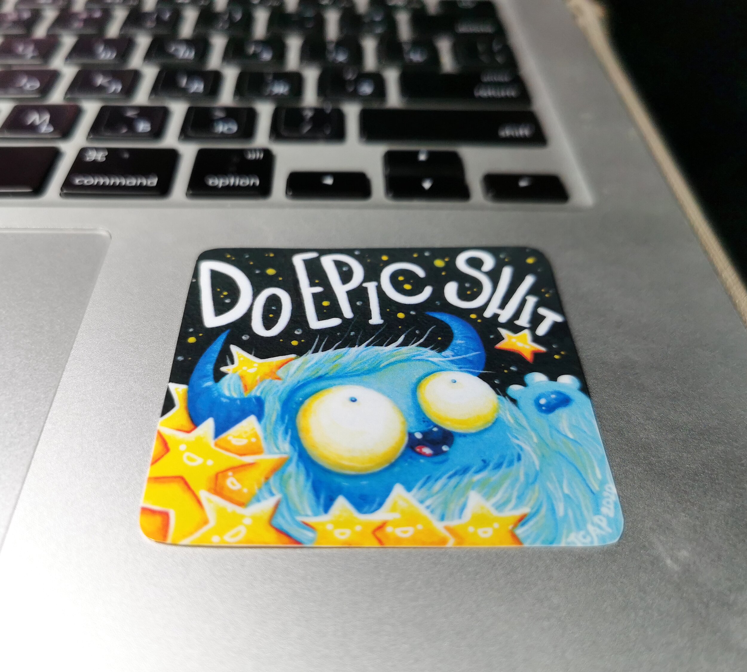 sticker-laying-on-macbook-laptop-and-featuring-yeti-and-words-do-epic-shit.jpeg