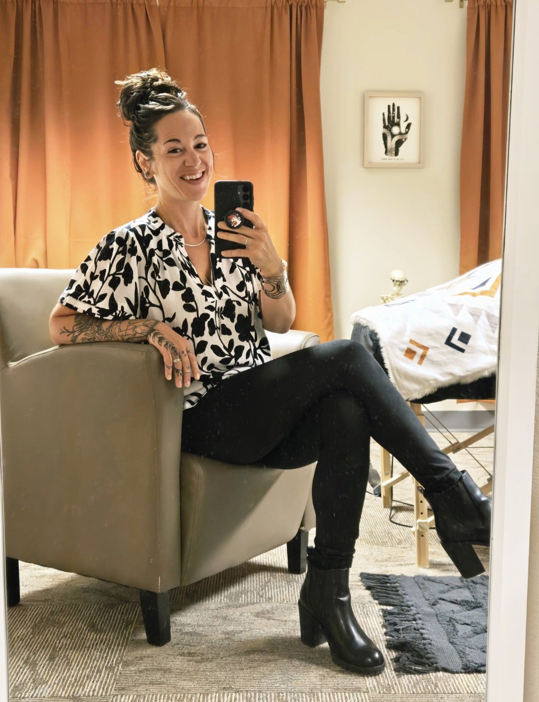 Katie Wessels, energy healer and psychic medium, seated in her private Westminster, Colorado office