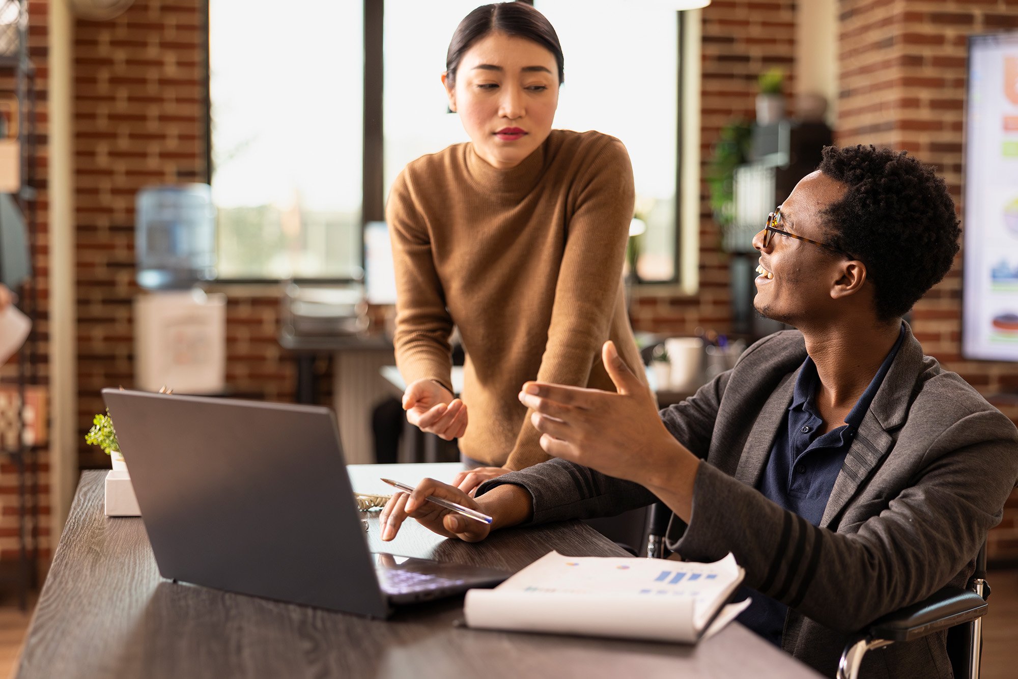 Two coworkers talking about legal support