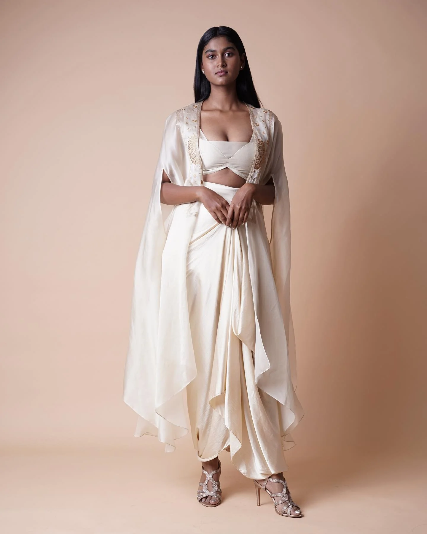 Introducing our ANNA ANNA POLKA collection. Here is our off white organza cape with polka hand embroidery, teamed with modal satin drape skirt and bustier. 

Model :- @____.ahskeemas.____ 

Photography:- @la_010875 

Stylist:- @thinksandhya 

Stylist