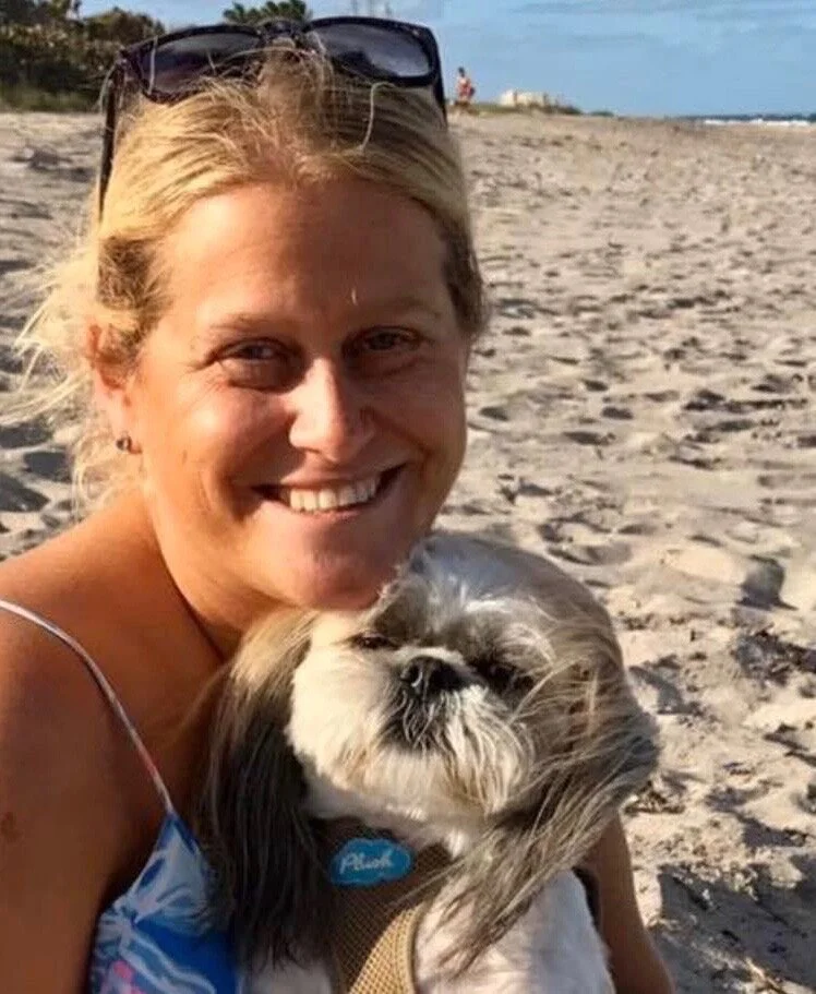 Lauren with dog on beach.jpg