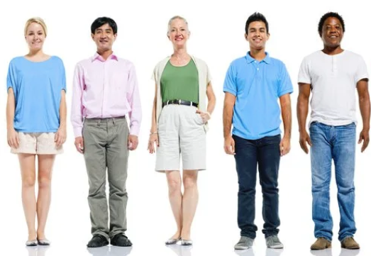 Five diverse people standing in a row against a white background, smiling.