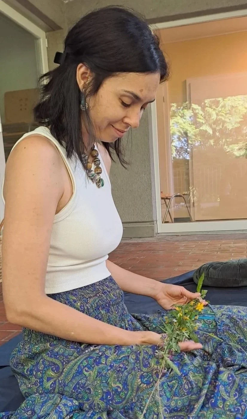 founder of Jazzibelle Skincare holding flowers in hand