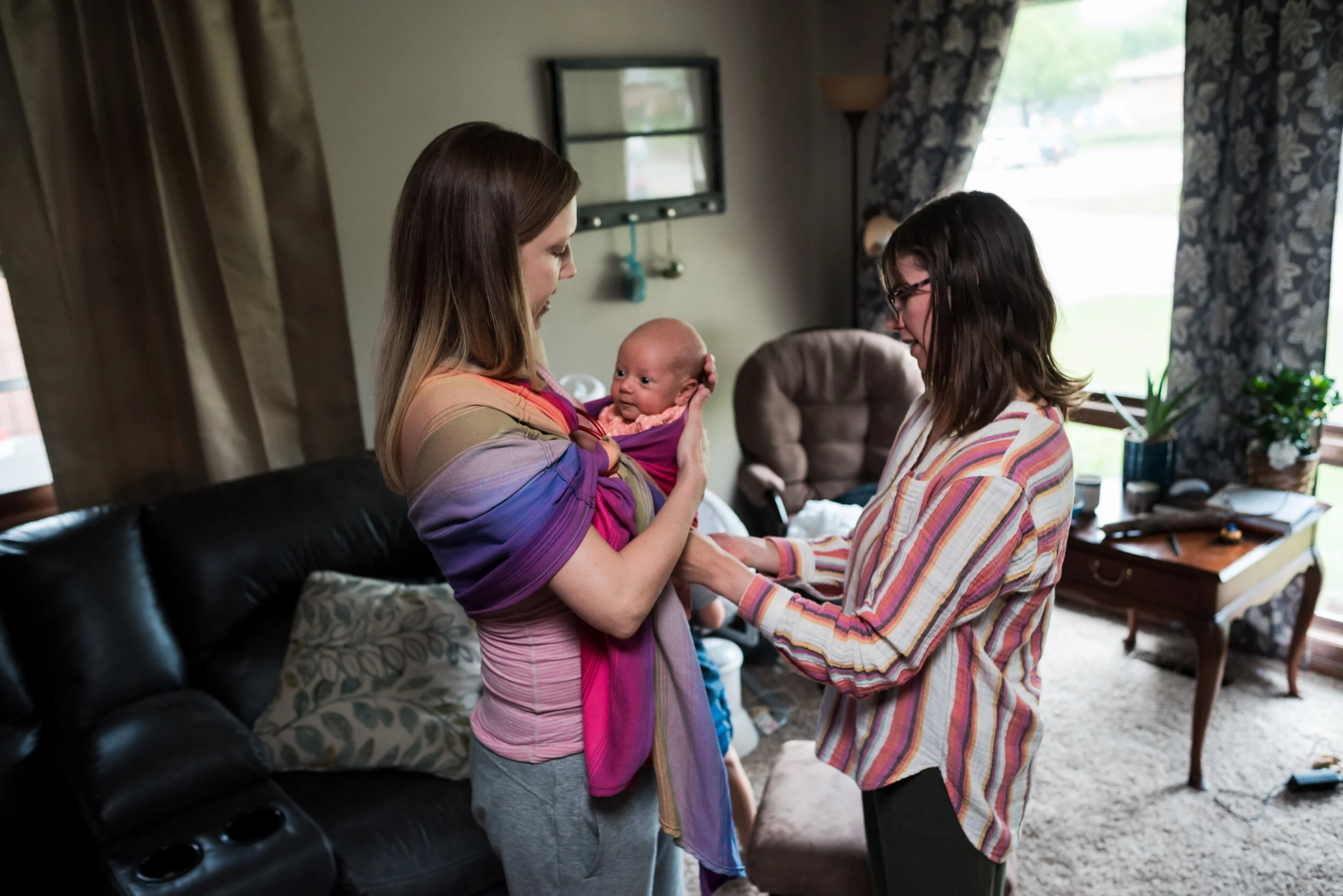 Postpartum doula helping mother after birth in Lincoln, NE