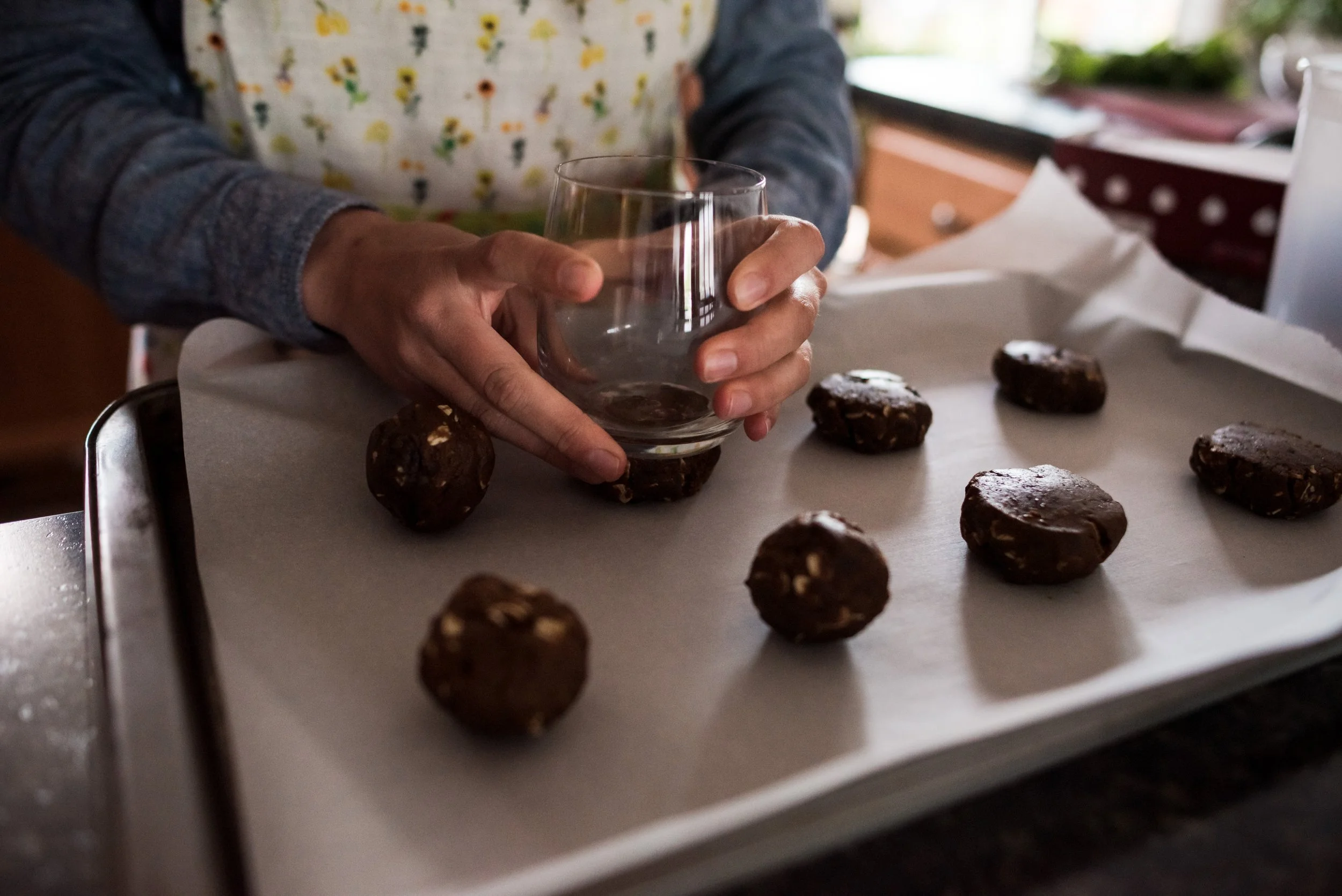 Postpartum doula preparing lactation cookies to support breastfeeding and postpartum nutrition