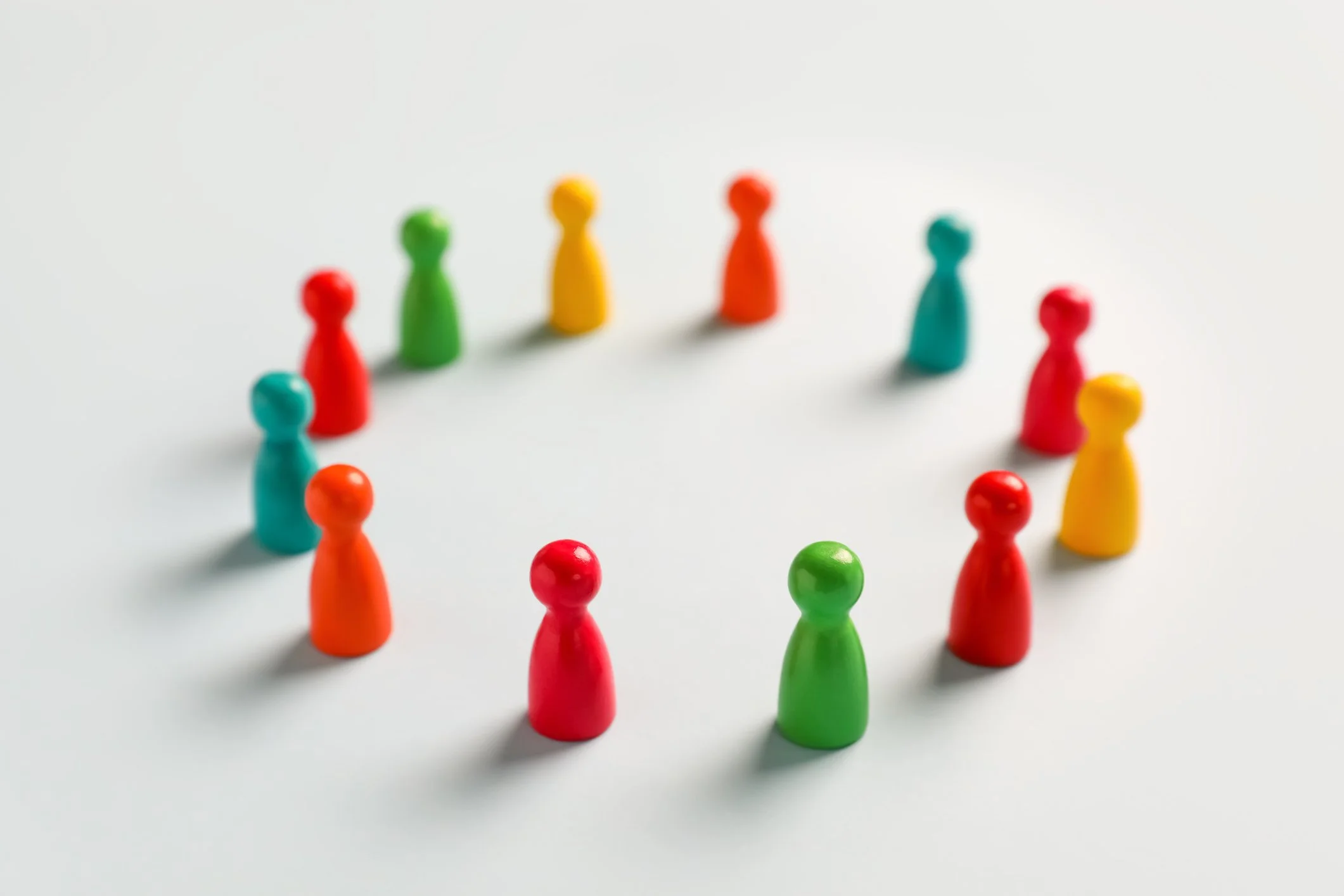 circle of colourful wooden human figure