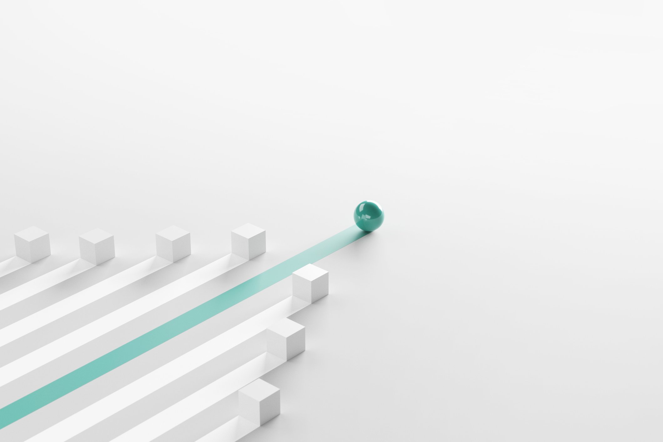 green ball rolling past white cubes