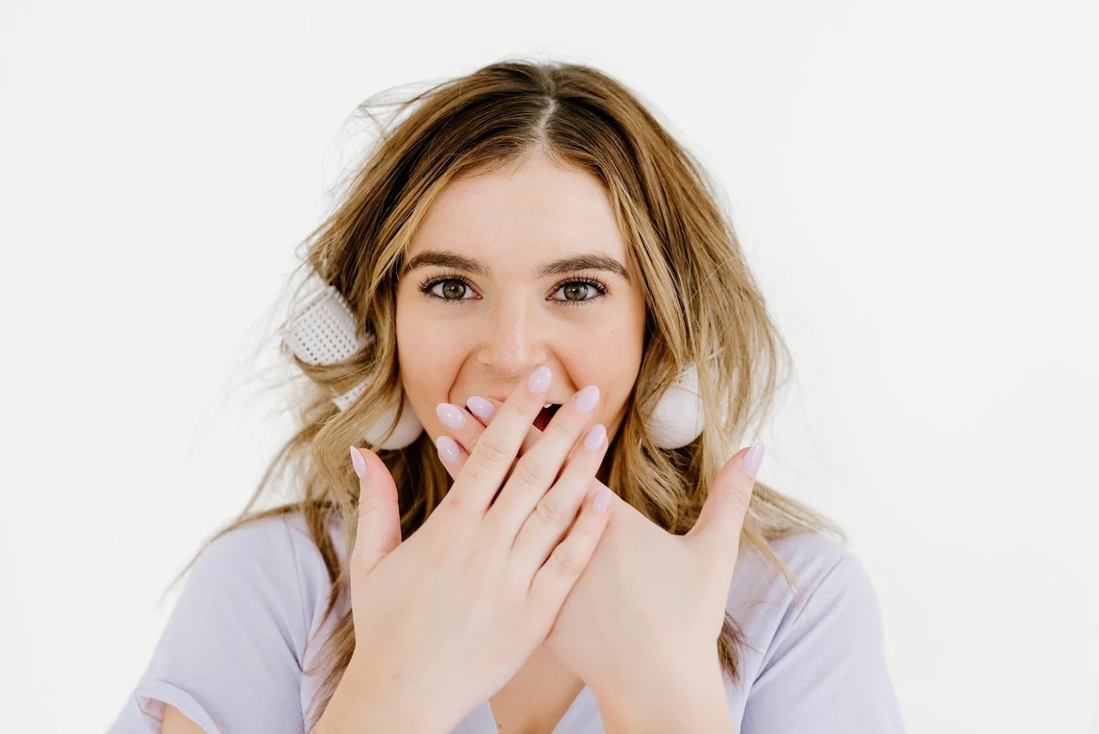 Woman with styled wavy hair featured alongside the TEAL TreatCard loyalty program announcement.