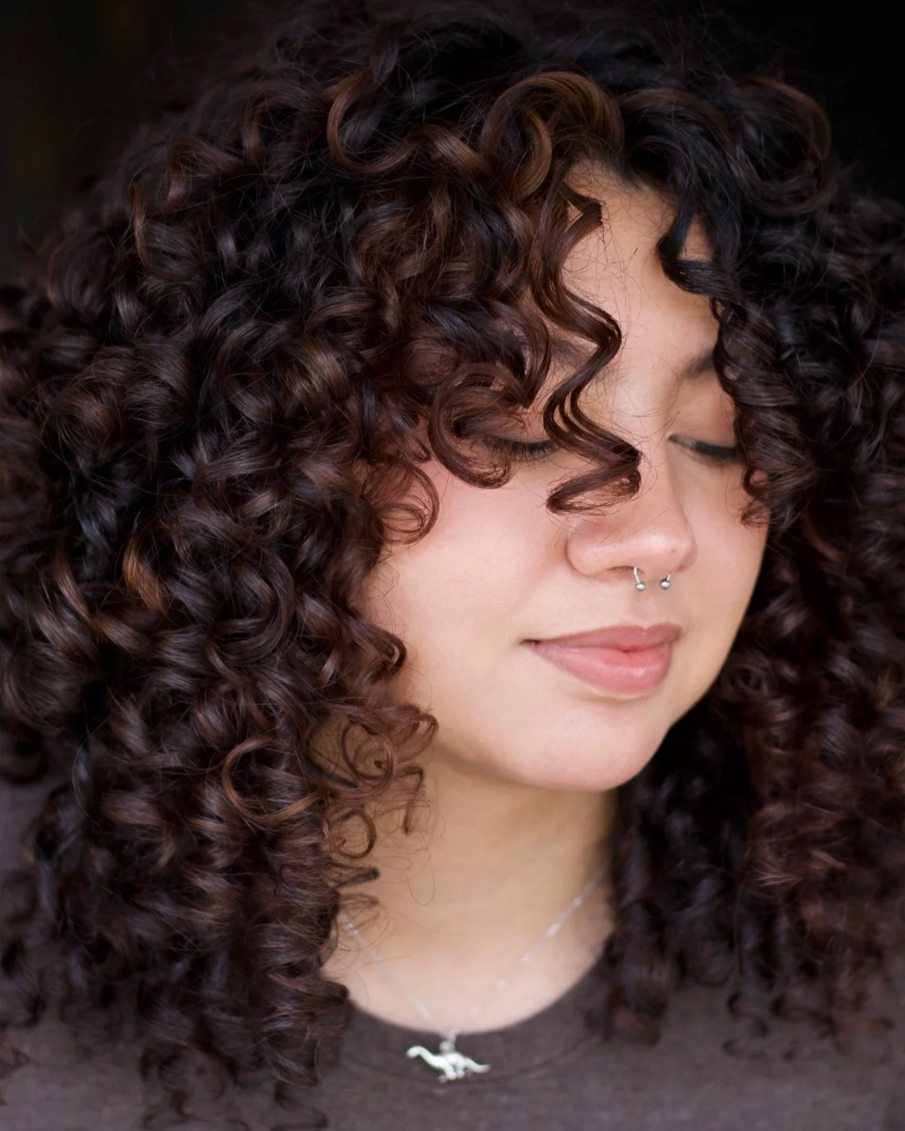 Defined brunette curls after a customized curl cut at TEAL Hair & Makeup Studio