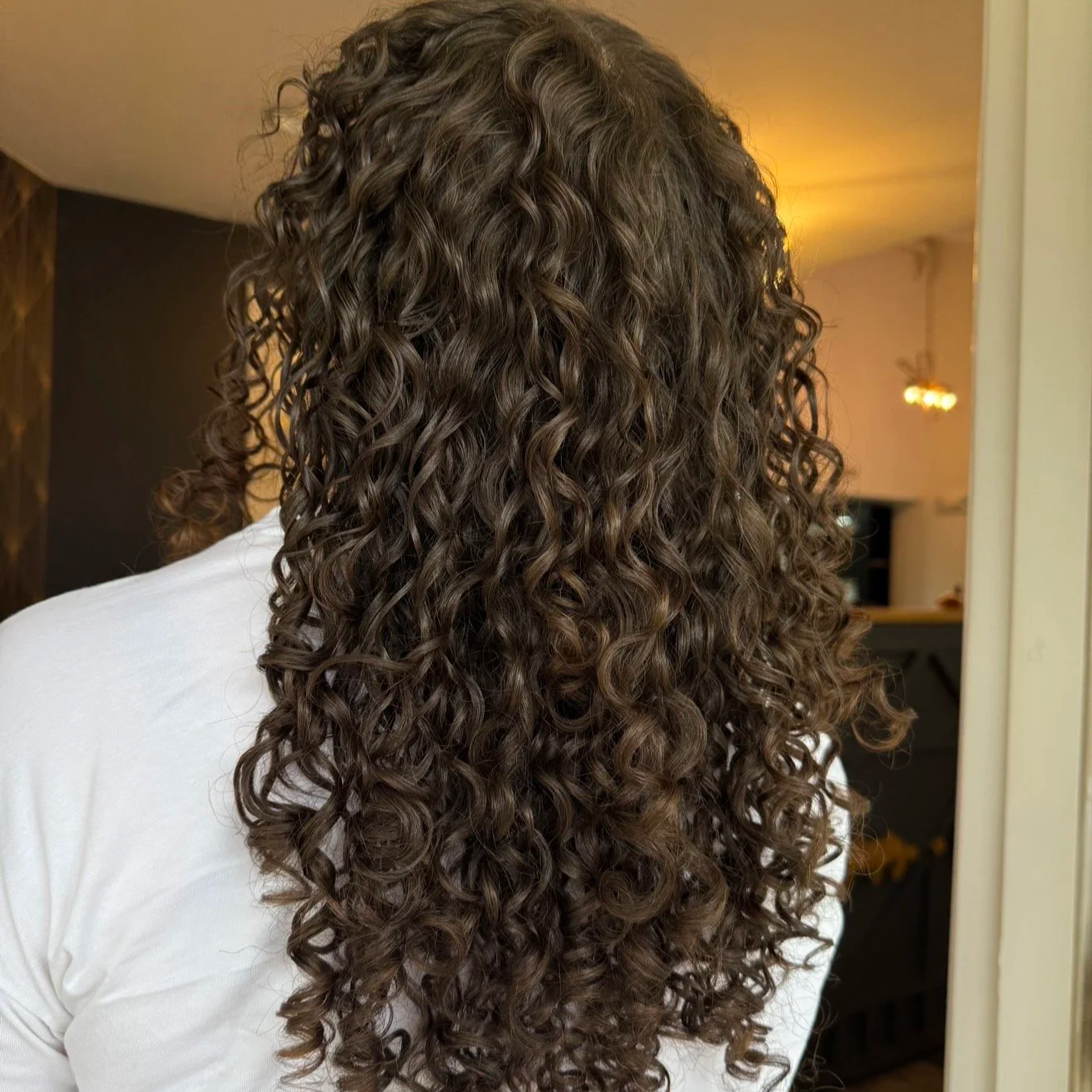 Defined natural curls after a customized curl cut at TEAL Hair & Makeup Studio