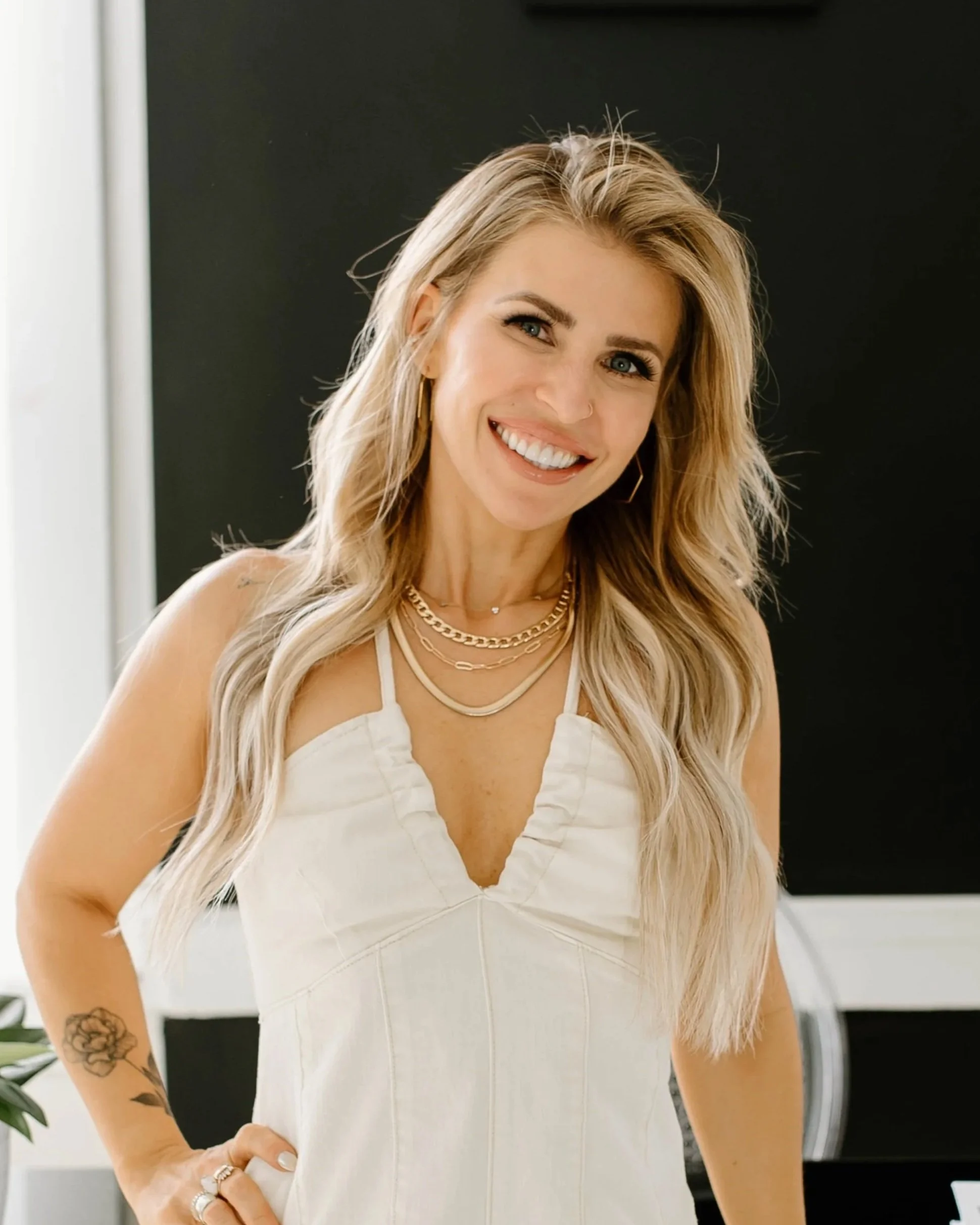 Long blonde hair styled in soft, voluminous waves representing Teal Studio Blowout Packages.