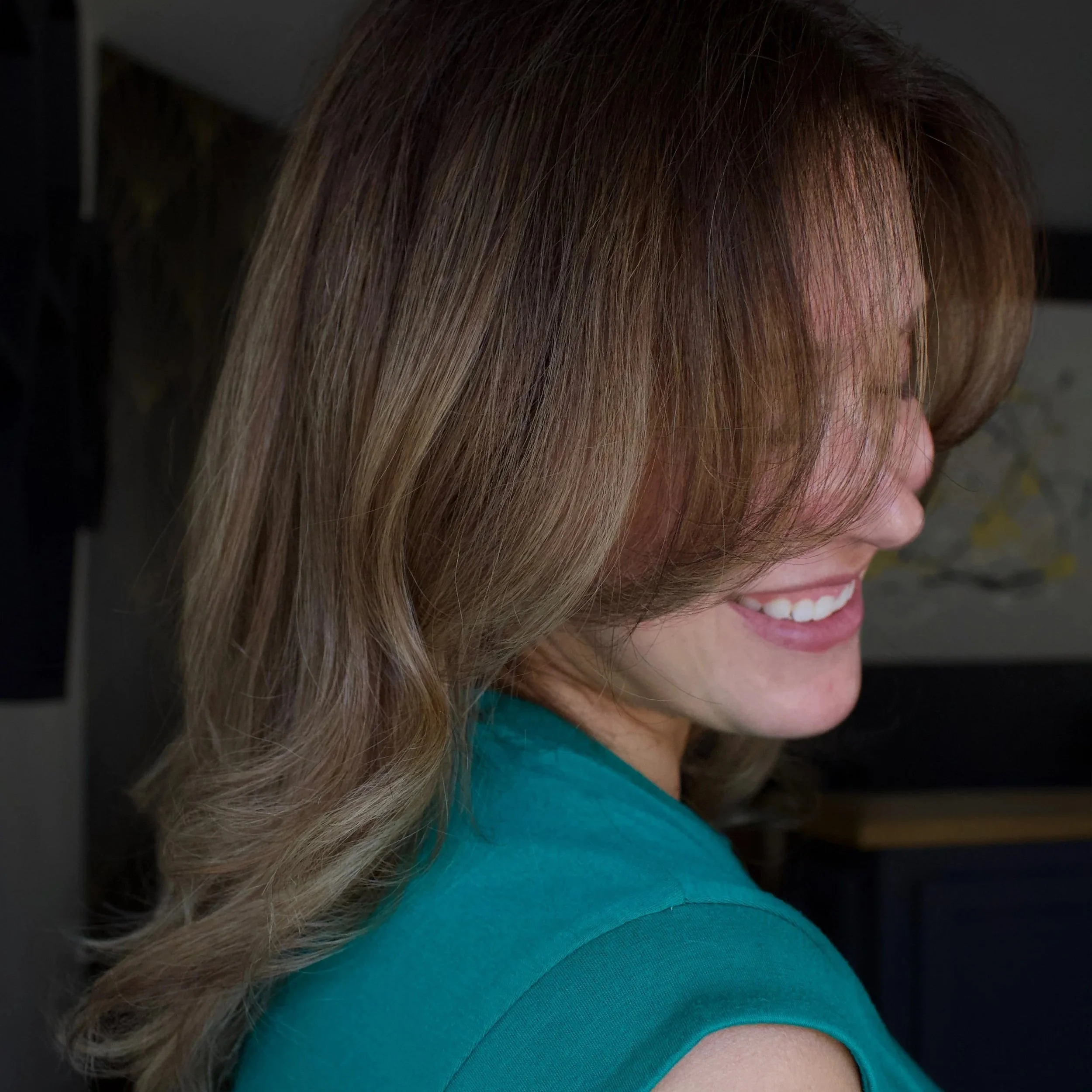 Dimensional lived-in brunette color with soft face-framing layers by Alliyah at TEAL Hair & Makeup Studio