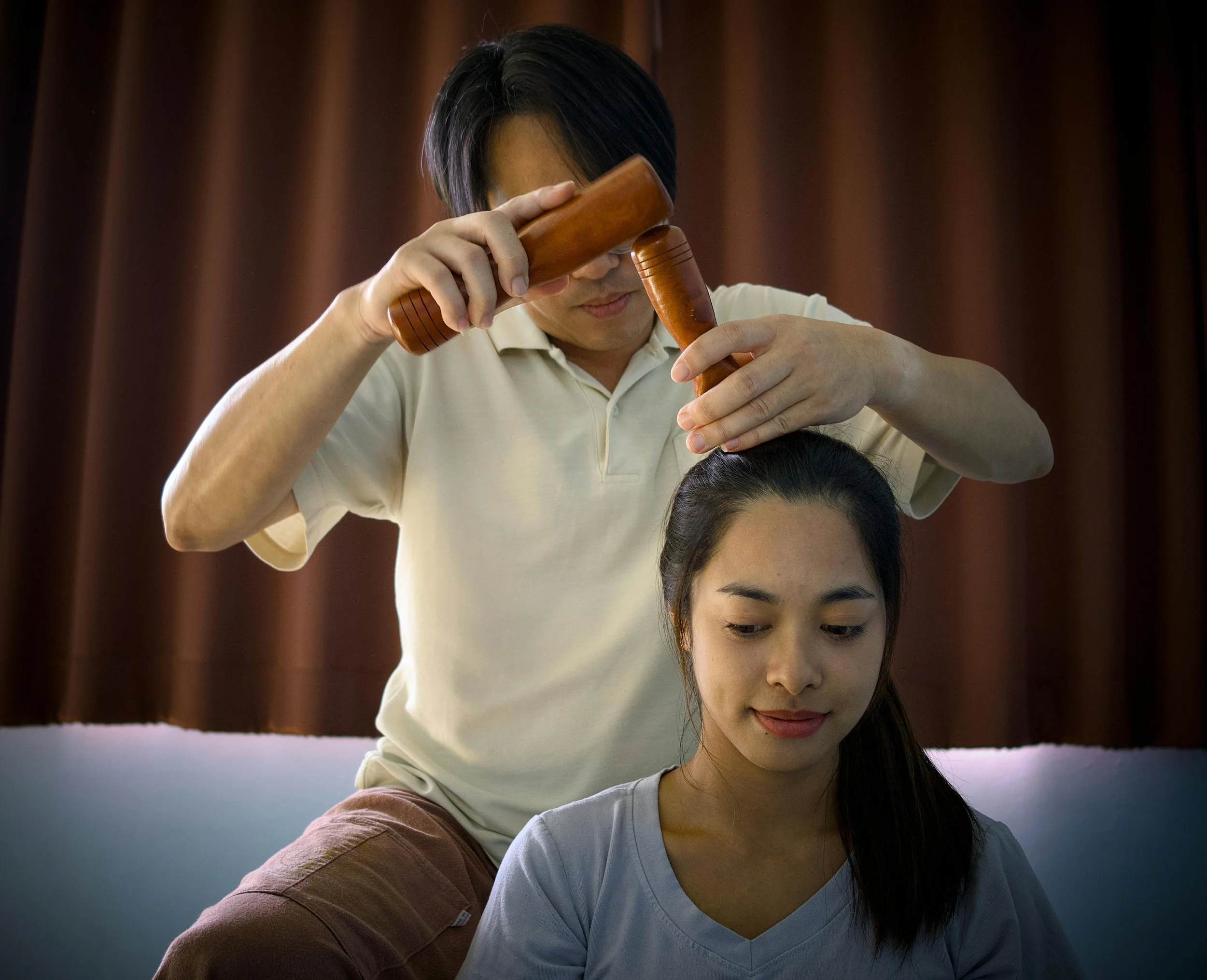Person receiving a relaxing scalp massage to stimulate circulation and promote healthy hair growth.