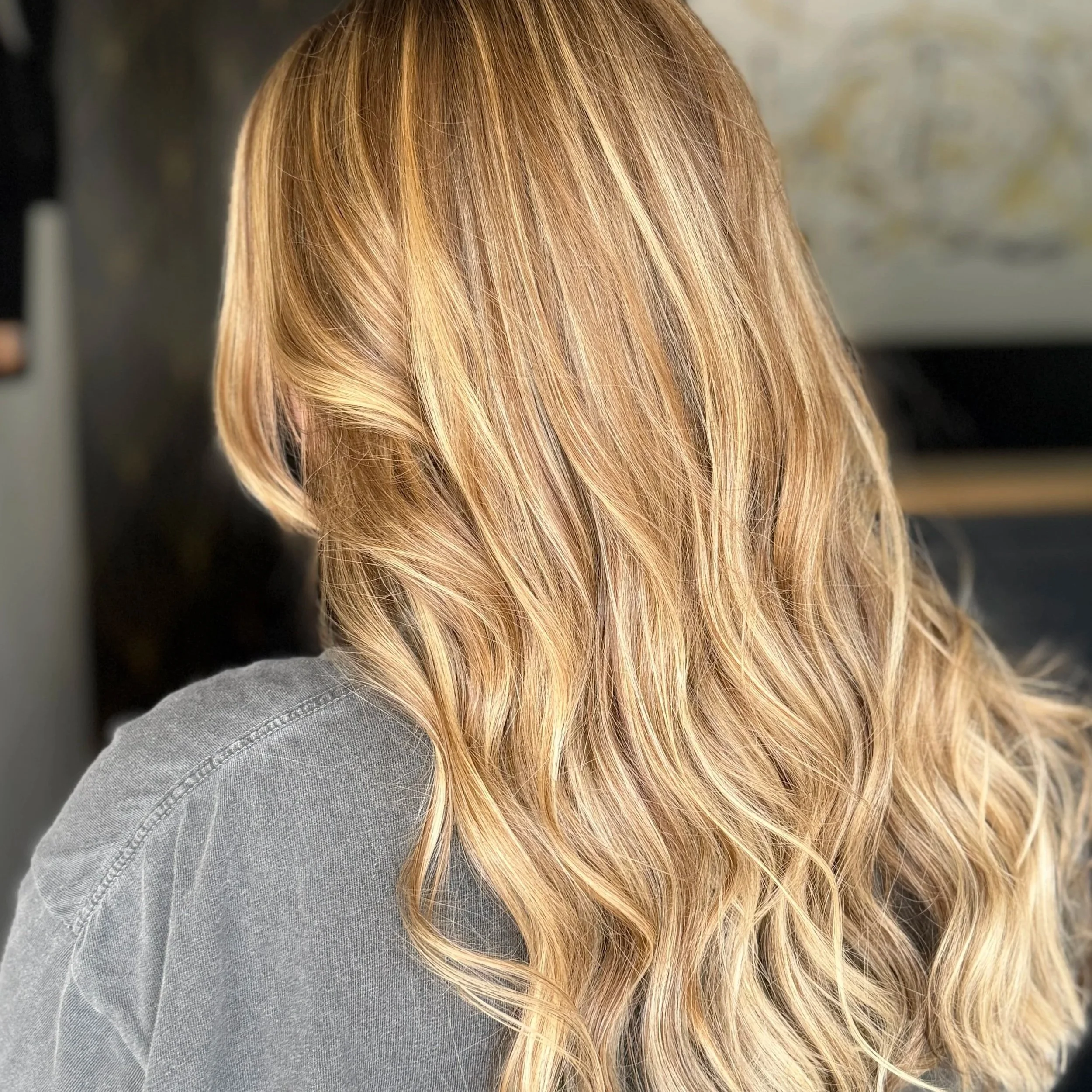 Dimensional lived-in blonde hair with soft highlights by Leah at TEAL Hair & Makeup Studio