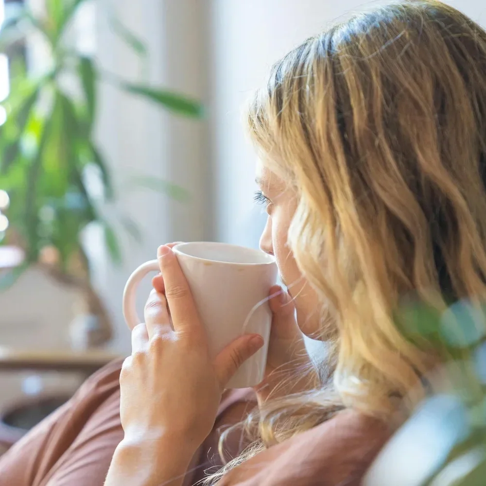 Woman with soft lived-in blonde hair and natural-looking dimension