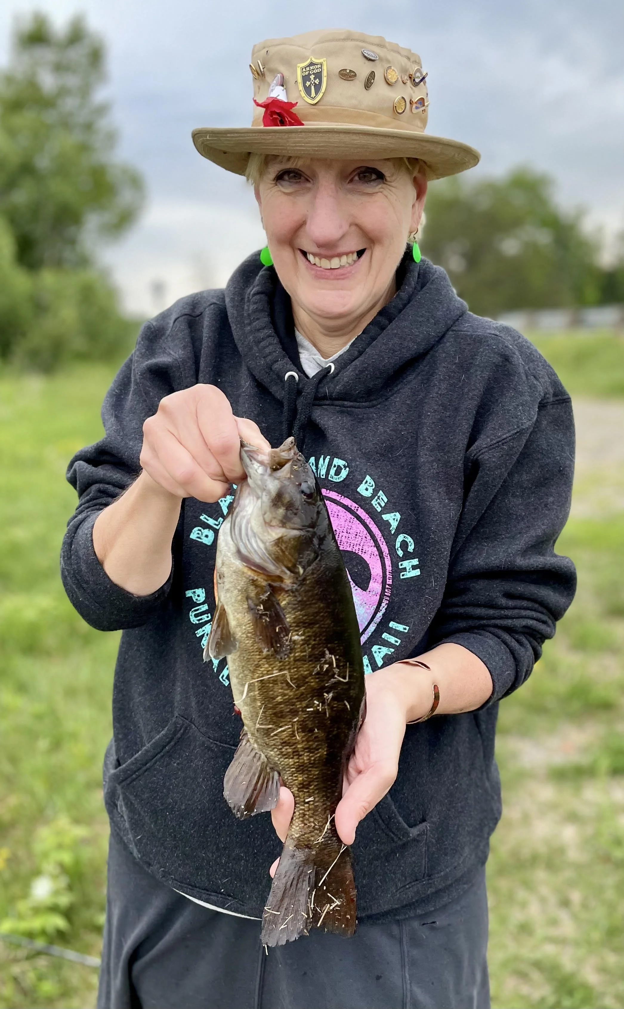 Angler holds smallmouth bass on Limit Creek Rod July 1, 2025 in Ely MN BWCA. Summer report from Arrowhead Outdoors.
