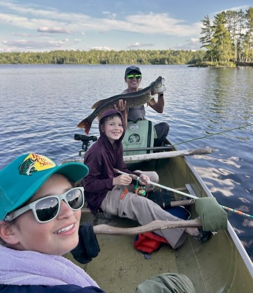 Family of young anglers with northern pike caught in the BWCA near Ely MN. Arrowhead Outdoors fishing report.