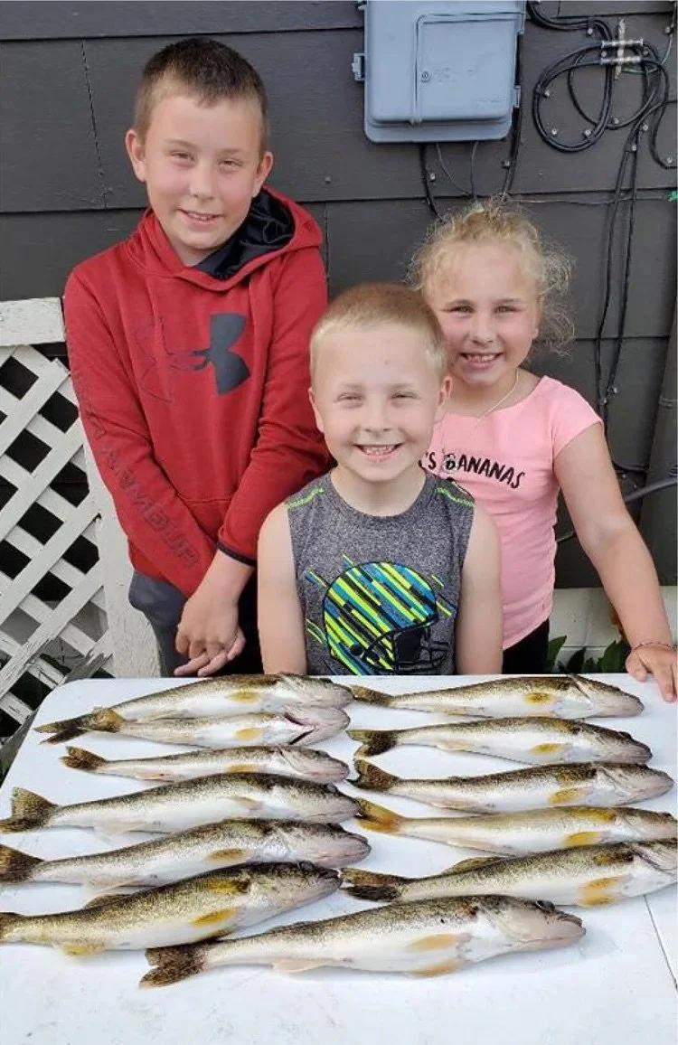 Kids family walleye catch Ely MN - Young anglers table of keepers Arrowhead Outdoors report