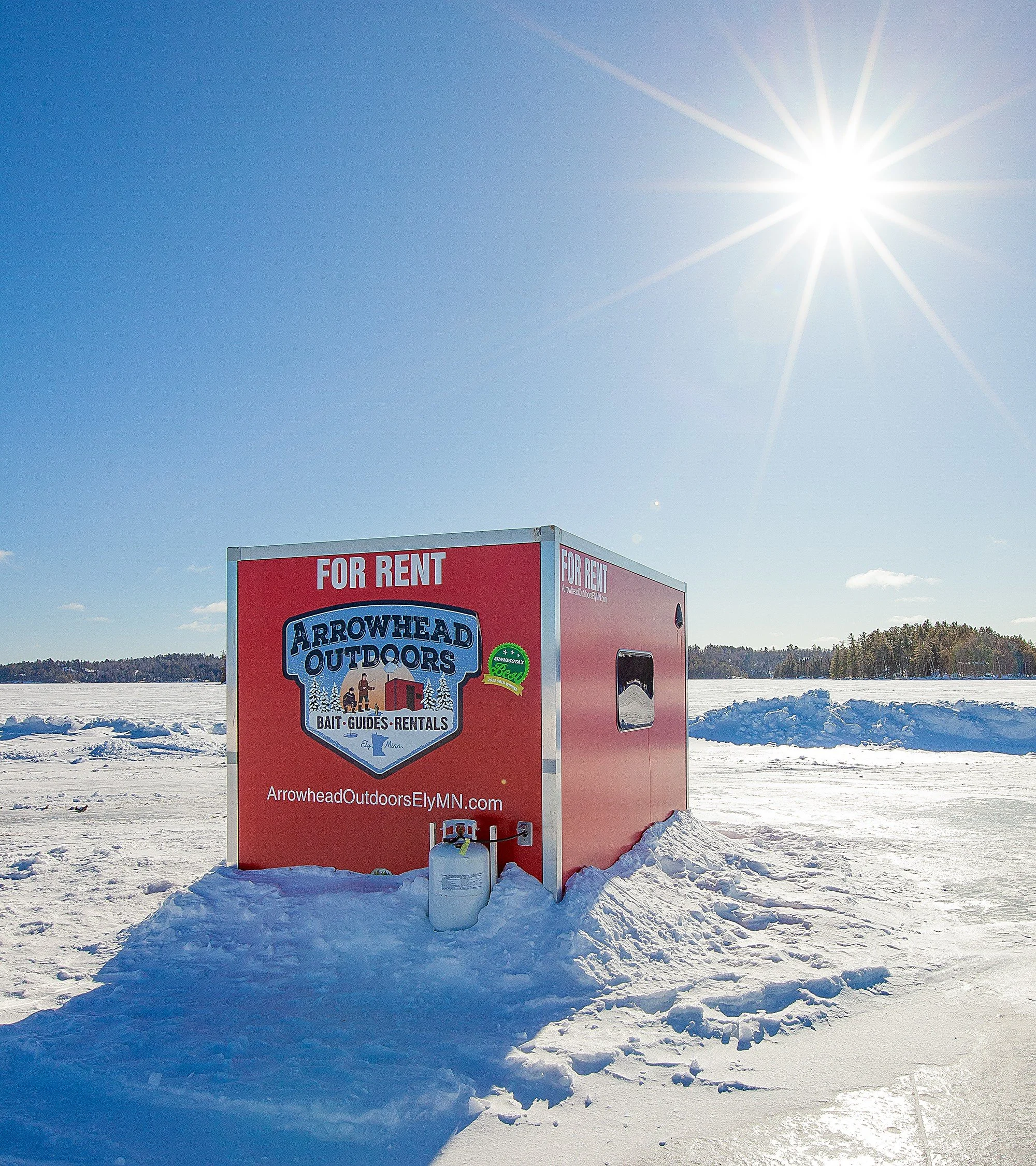 Arrowhead Outdoors heated ice house rental on frozen lake near Ely MN BWCA. Cold morning walleye, lake trout & eelpout fishing.