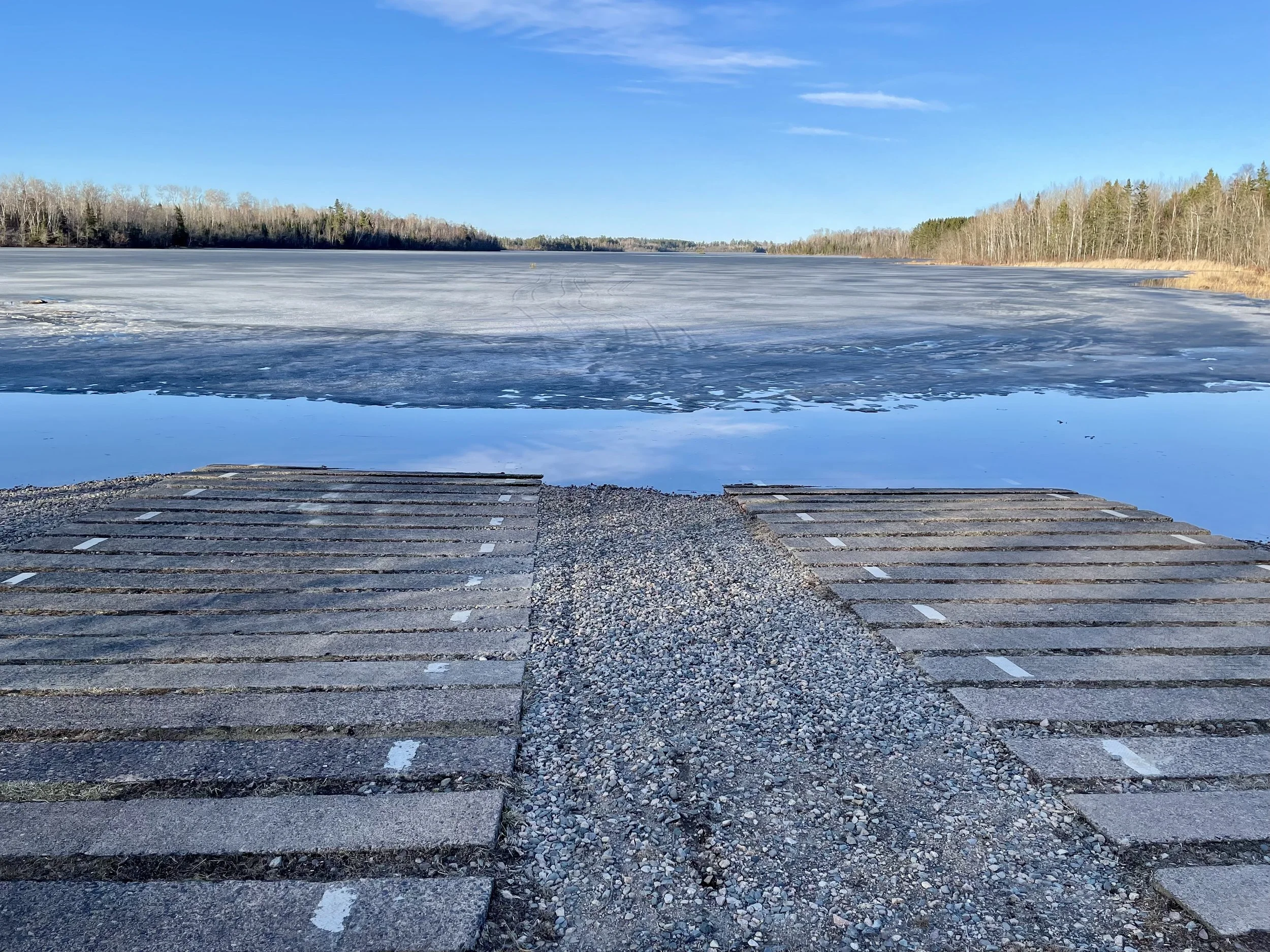 Fall Lake public access on April 21 2026 with ice coming off in Ely MN BWCA area. Sunny spring ice-out update.