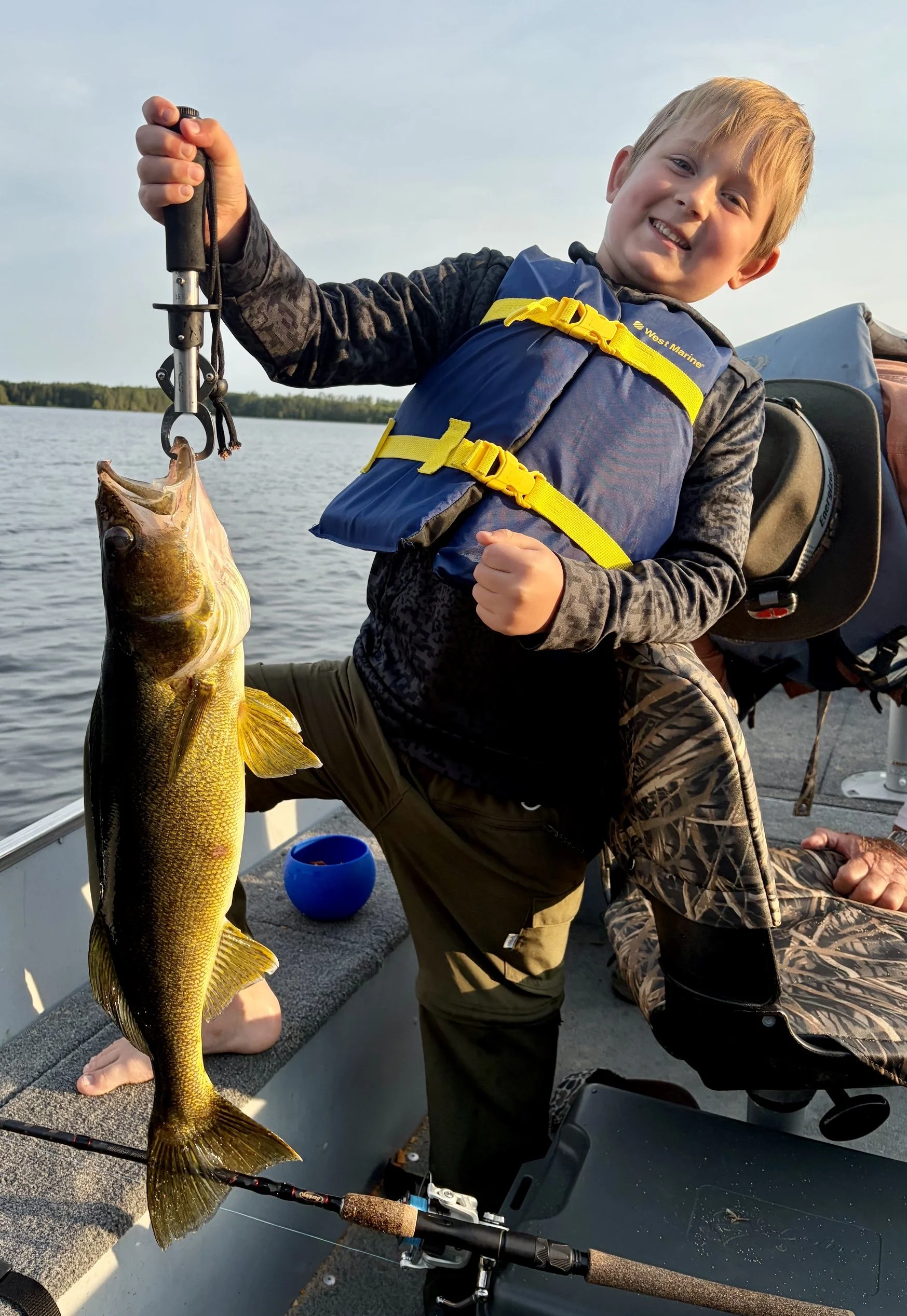 7-year-old Raylan Stanfield with 25-inch walleye caught on Basswood Lake near Ely MN. Arrowhead Outdoors fishing report.