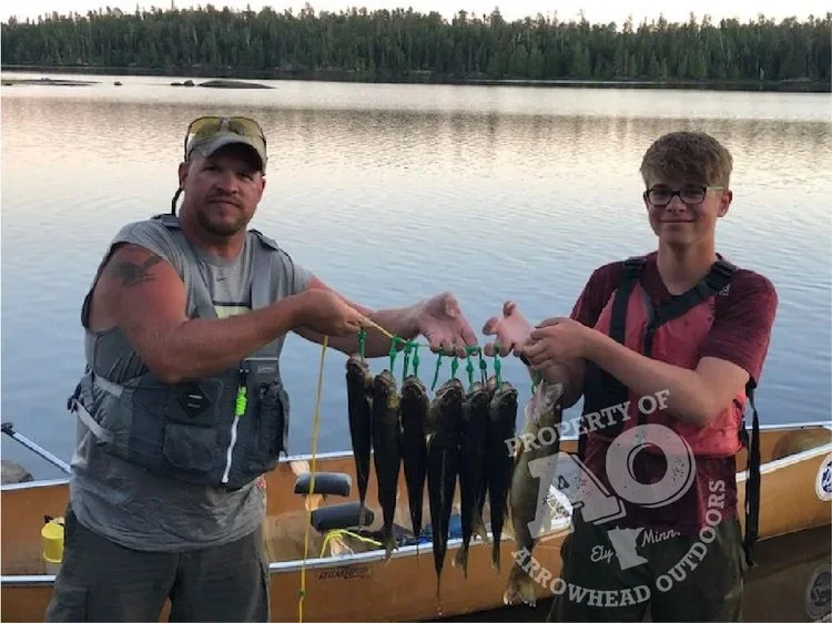 BWCA walleye stringer August 4 2020 Ely MN - Family dad son eater walleyes hold Boundary Waters Arrowhead Outdoors report