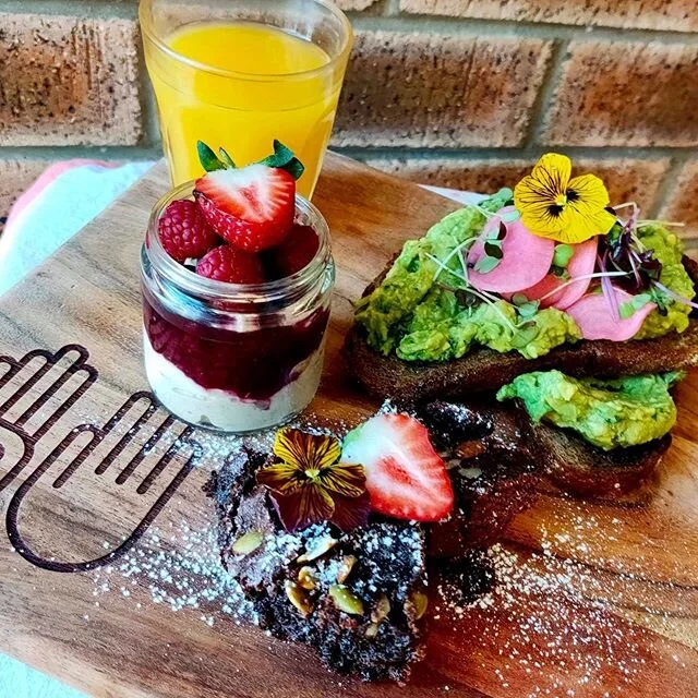 Our new breaky board. Smashed avo w house made vegemite on rye + Parfait yoghurt jar + sweet treat & a little juice. Thank you @dee_and_co_designs for our awesome boards. 📷 photo credit @mai121321