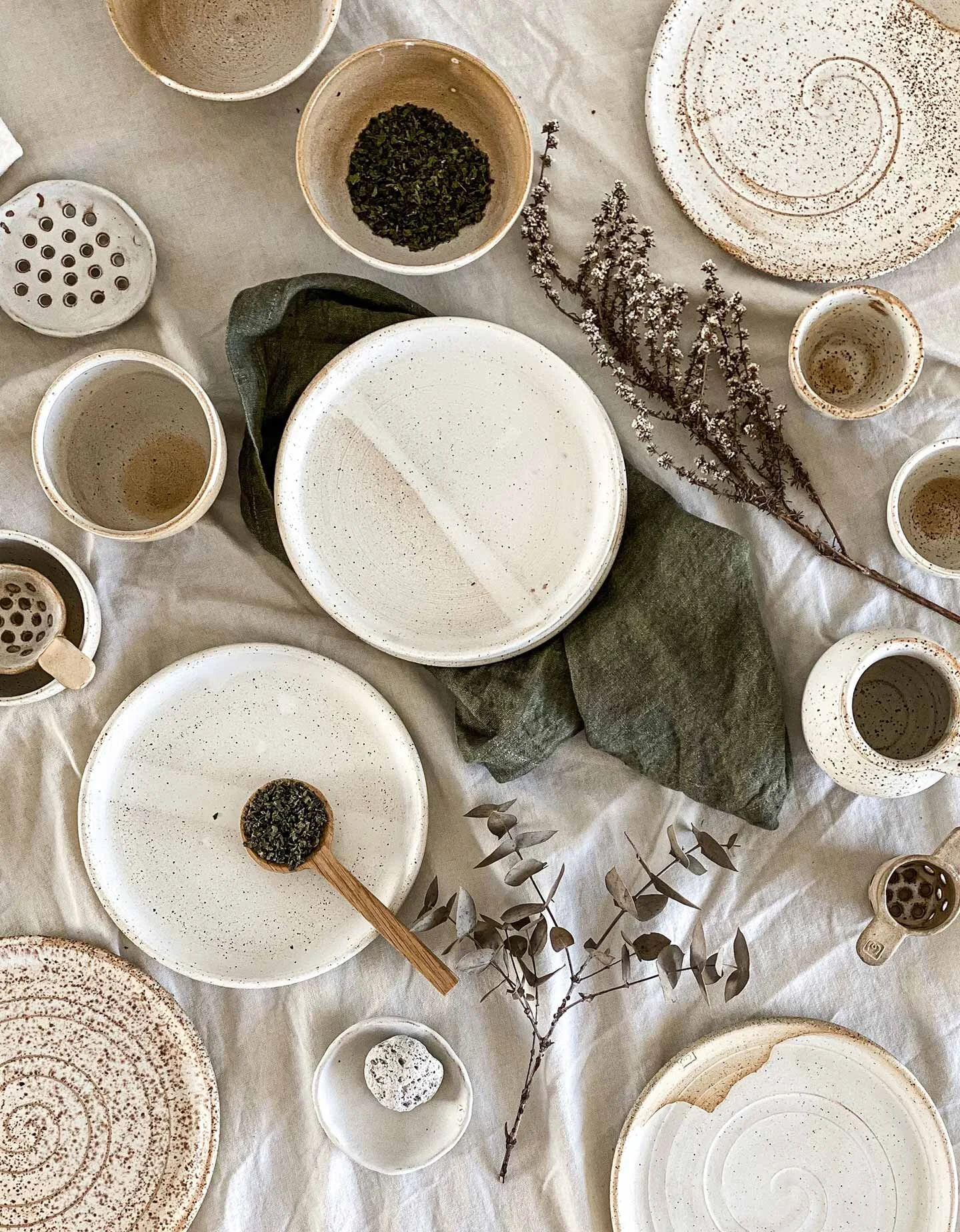 Flat-lay-plates-mugs-tea-strainer.jpg