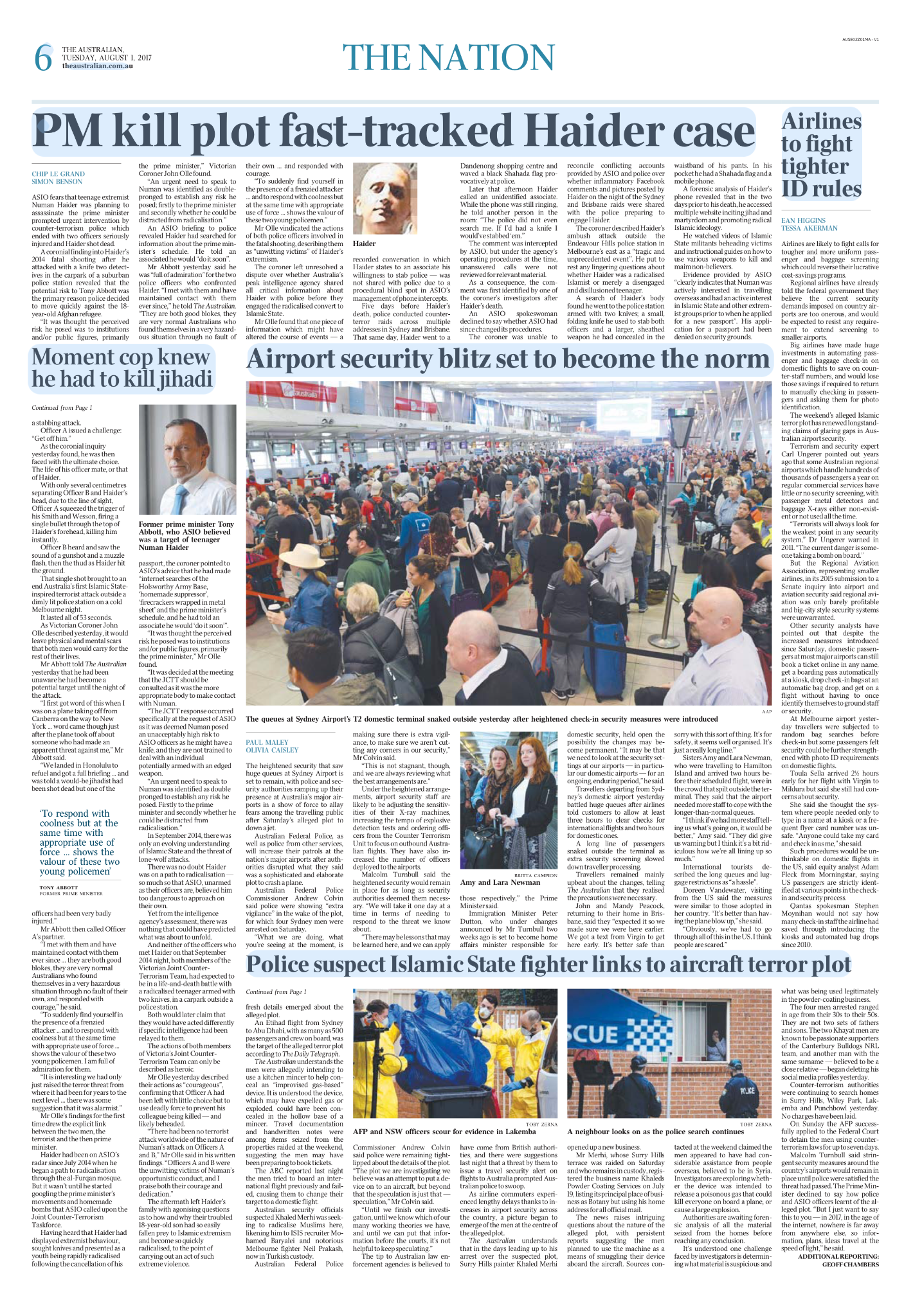 A large crowd of people sitting and waiting in an airport terminal, with some standing in line at the security checkpoint.