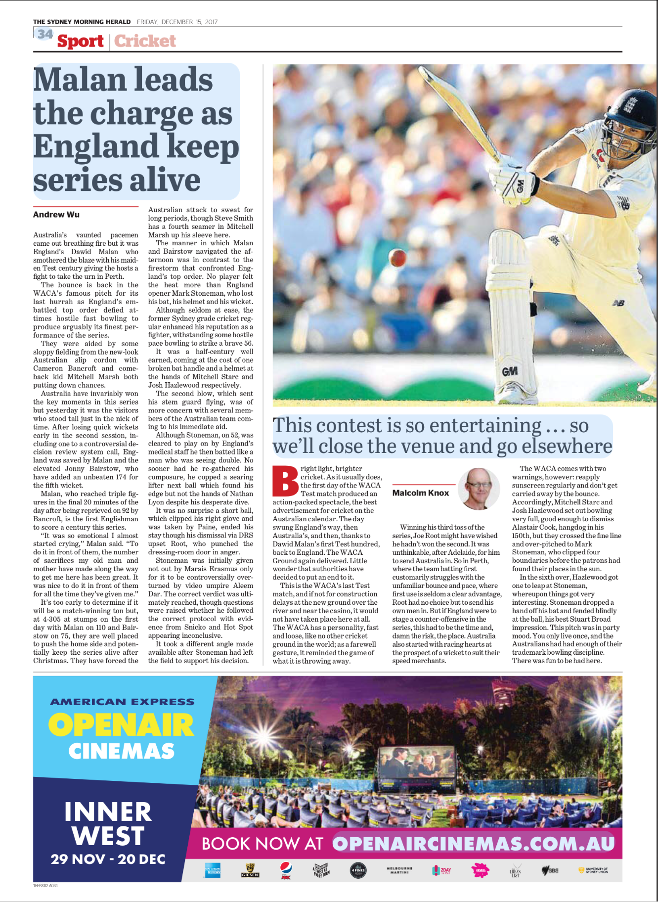 A cricket player in white uniform and helmet swings his bat to hit a cricket ball on a green pitch during a match, with a blurred crowd in the background.