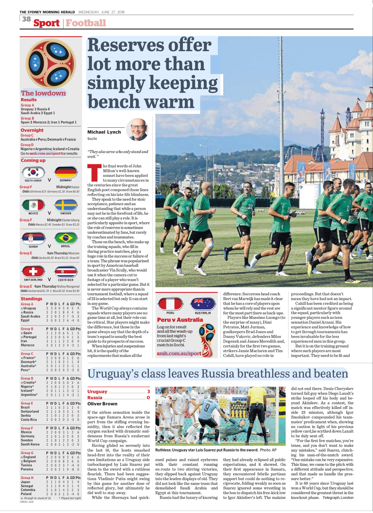 Newspaper sports article featuring a soccer team practicing on the field, with a background of blue sky, clouds, and a cityscape including a castle-like building and tall lighting structures.
