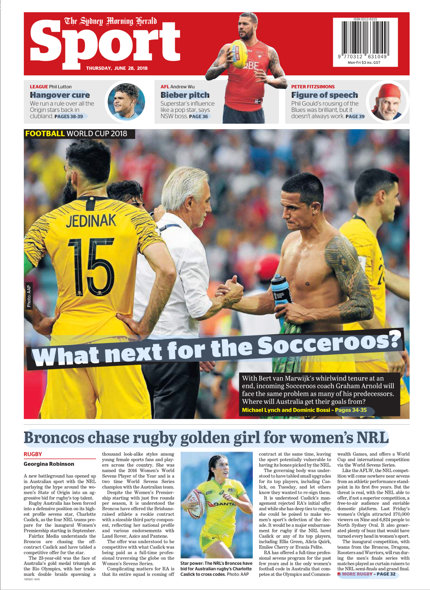 Australian rugby player Charlotte Caslick holding a rugby ball, wearing a yellow jersey with the Qantas logo, standing outdoors with a woman in the background.