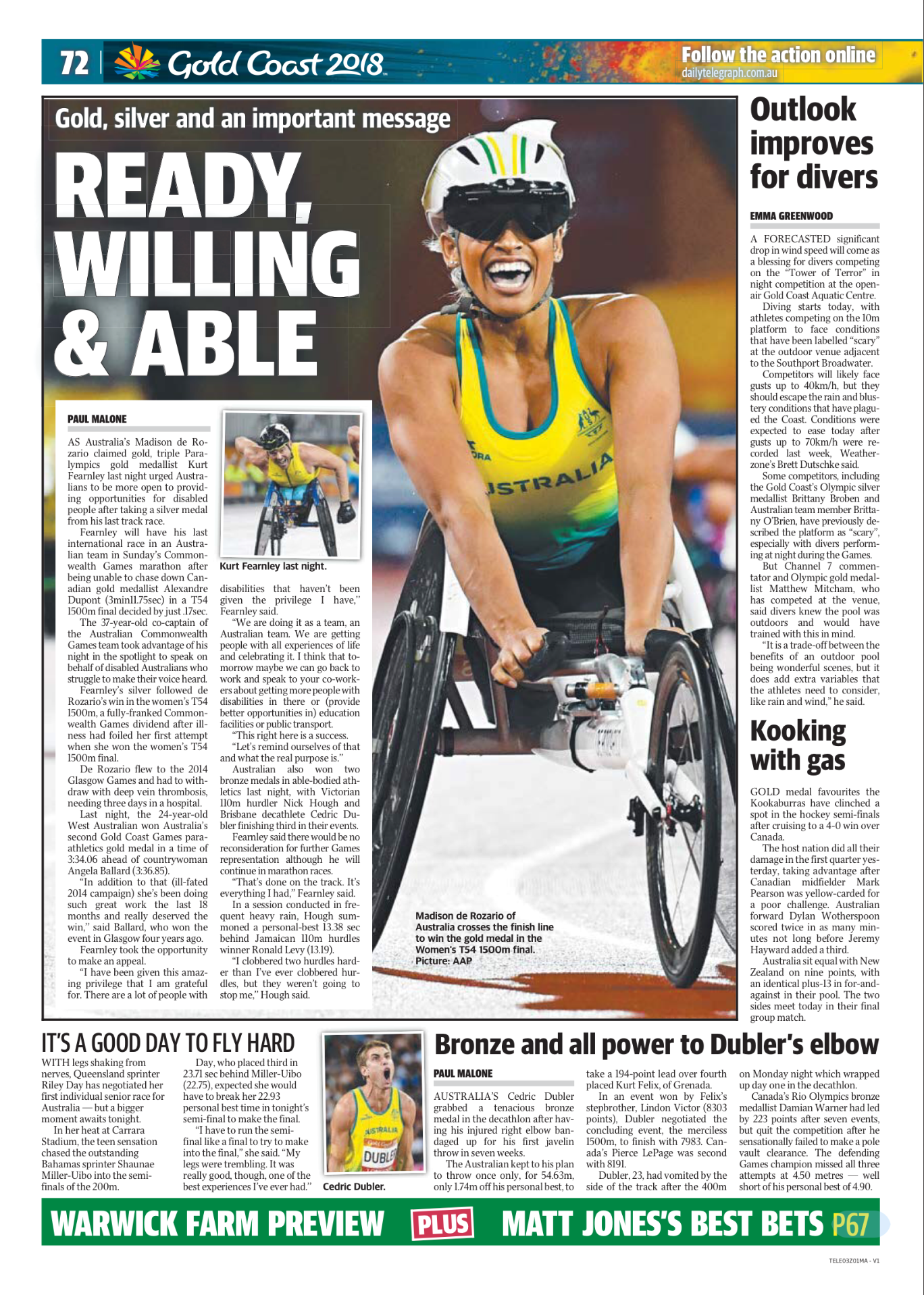 A woman in a yellow and green Australian athletic uniform smiling while riding a racing wheelchair, celebrating after a race. She is wearing a helmet and sports glasses.