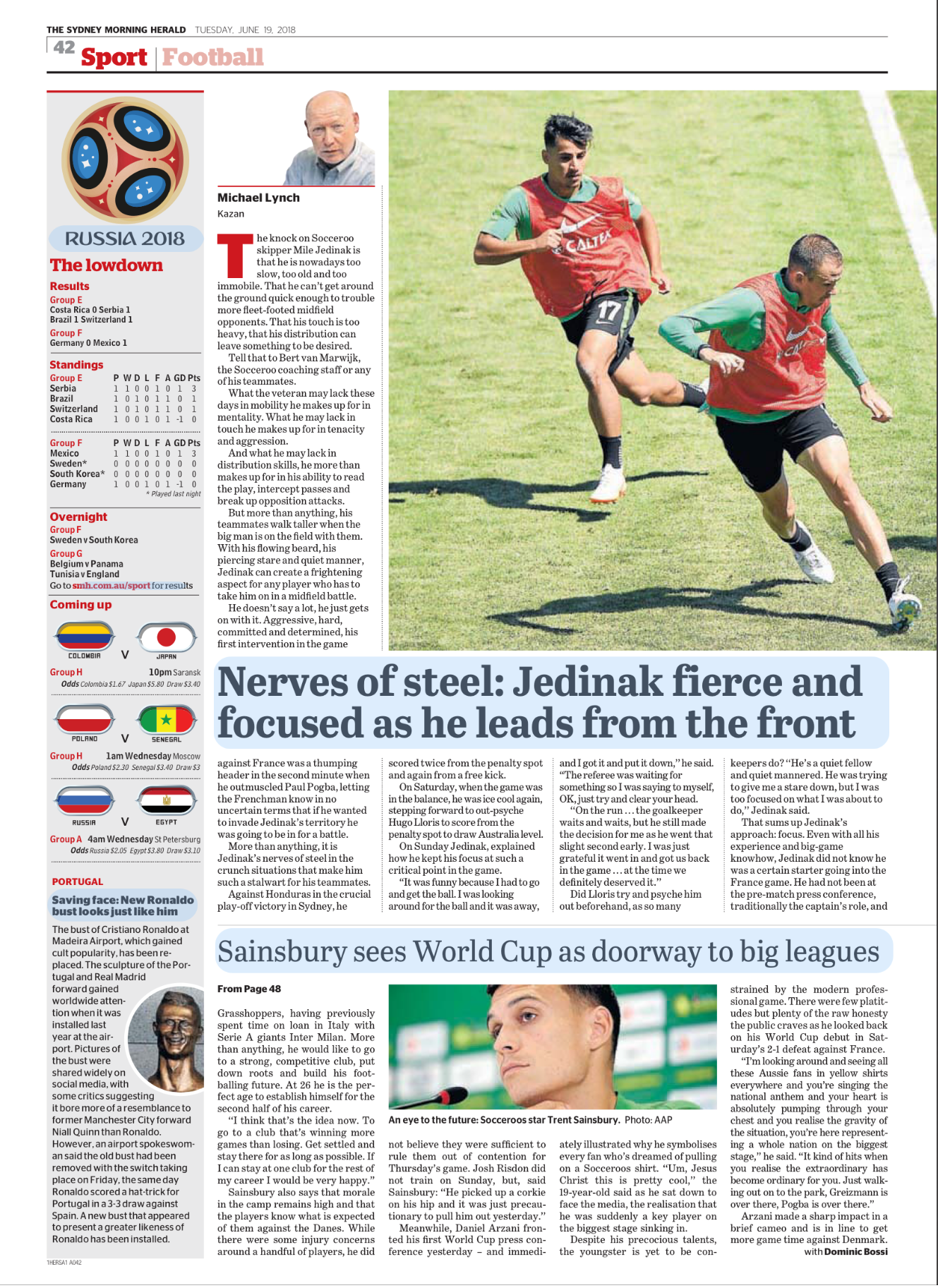 Newspaper sports section showing a photo of two young soccer players running on the field during practice or a game. The headline reads "Nerves of steel: Jedinak fierce and focused as he leads from the front." A column of commentary and match results