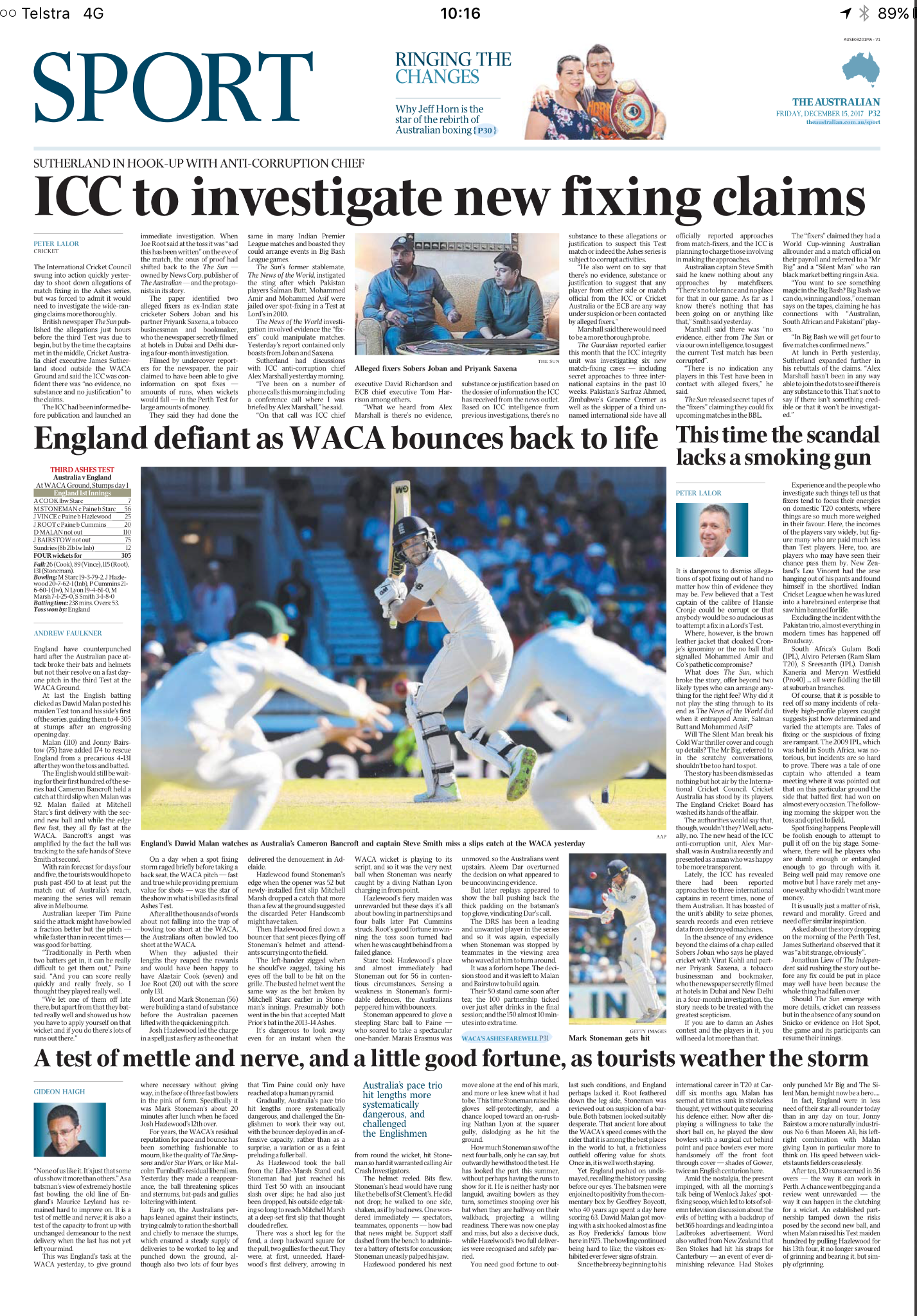 Cricket player batting during a match, with players and spectators in the background.