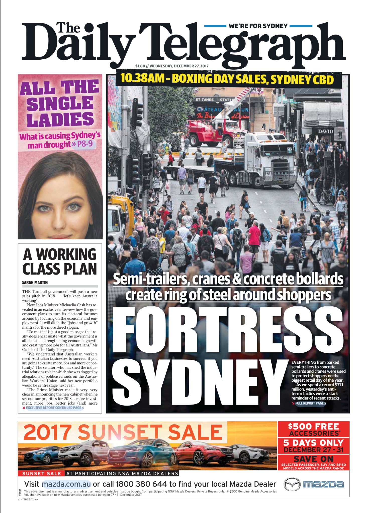 Front page of The Daily Telegraph newspaper featuring a large photo of Sydney city street with people crossing, semi-trailers, cranes, and concrete bollards creating a ring around shoppers, with headlines about Sydney's fortress security and Boxing D