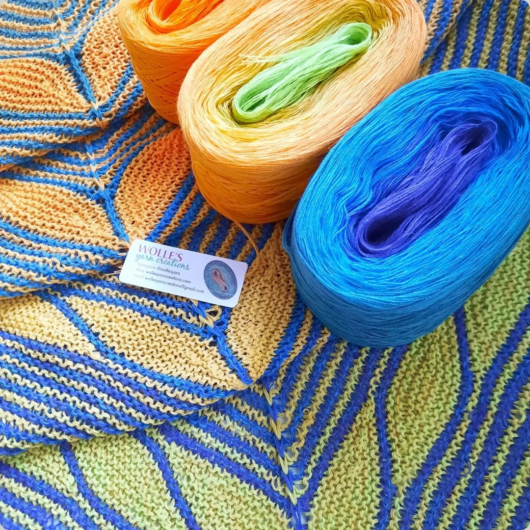 New shawl: Ukraine Snood (free pattern by Svetlana Gordon) knitted in colors PURPLE and SQUASH. Beautiful asymmetrical shawl with a pretty leaf motif. We have kits on our website: wollesyarncreations.com/kits  Thank you to Bitty for knitting this sha
