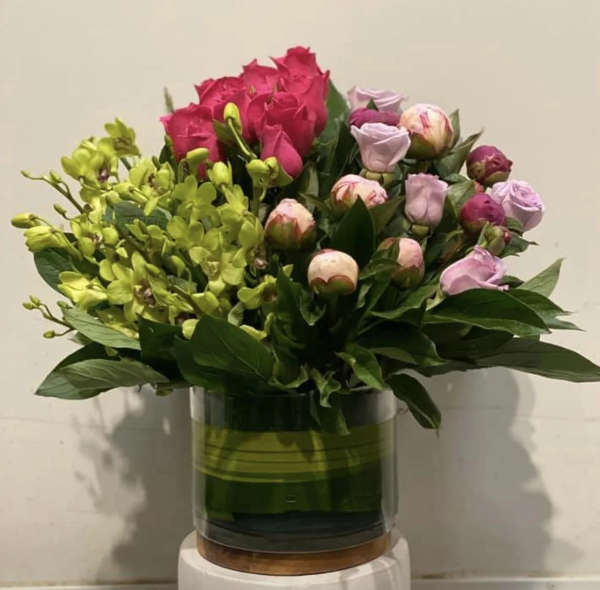 JACQUELINE - LEAF LINED GLASS VASE OF MIXED PREMIUM BLOOMS