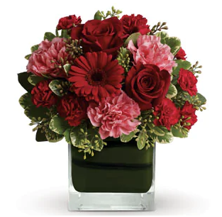 TERESA - Leaf lined glass vase of mixed flowers