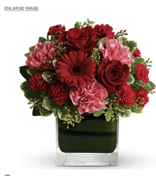 TERESA - Leaf lined glass vase of mixed flowers