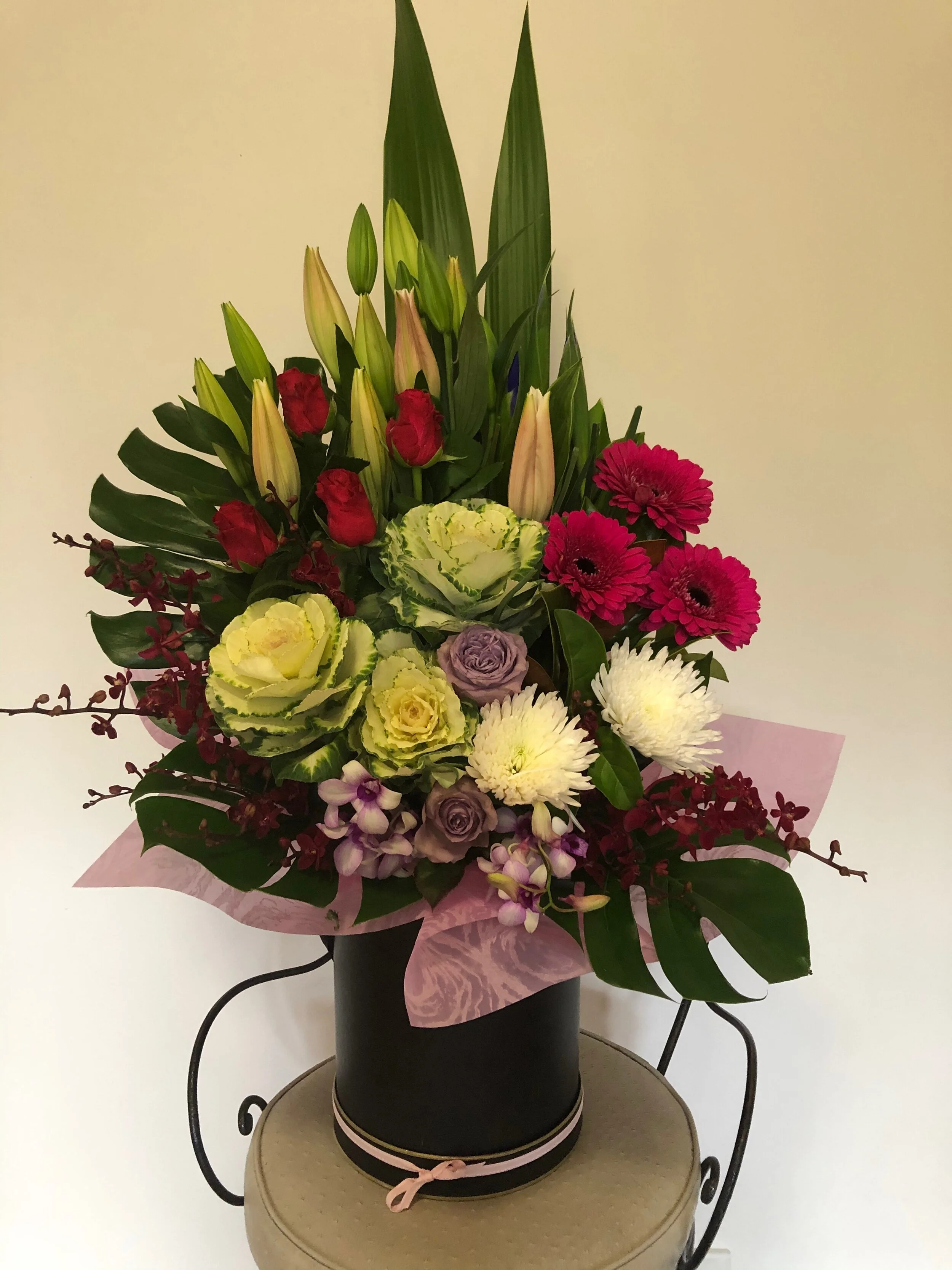 HAT BOX OF FLOWERS IN PINK TONES