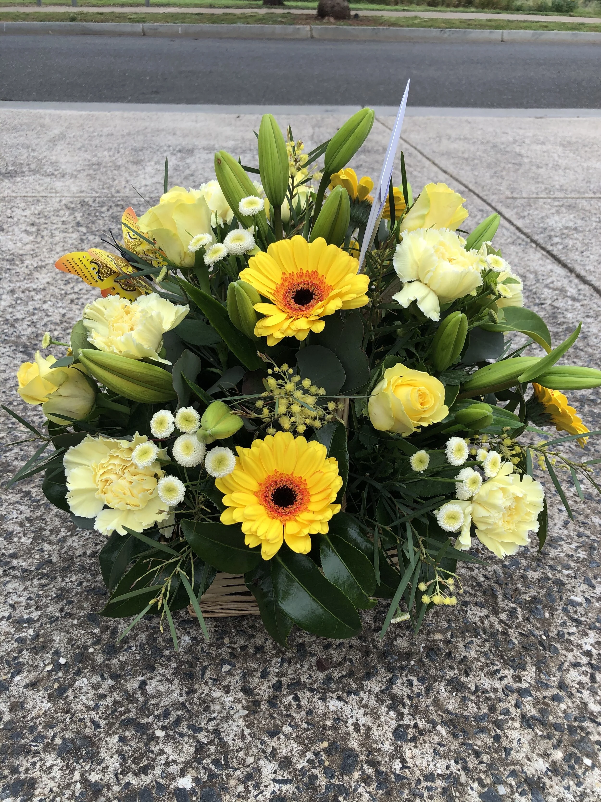 BASKET OF YELLOW FLOWERS