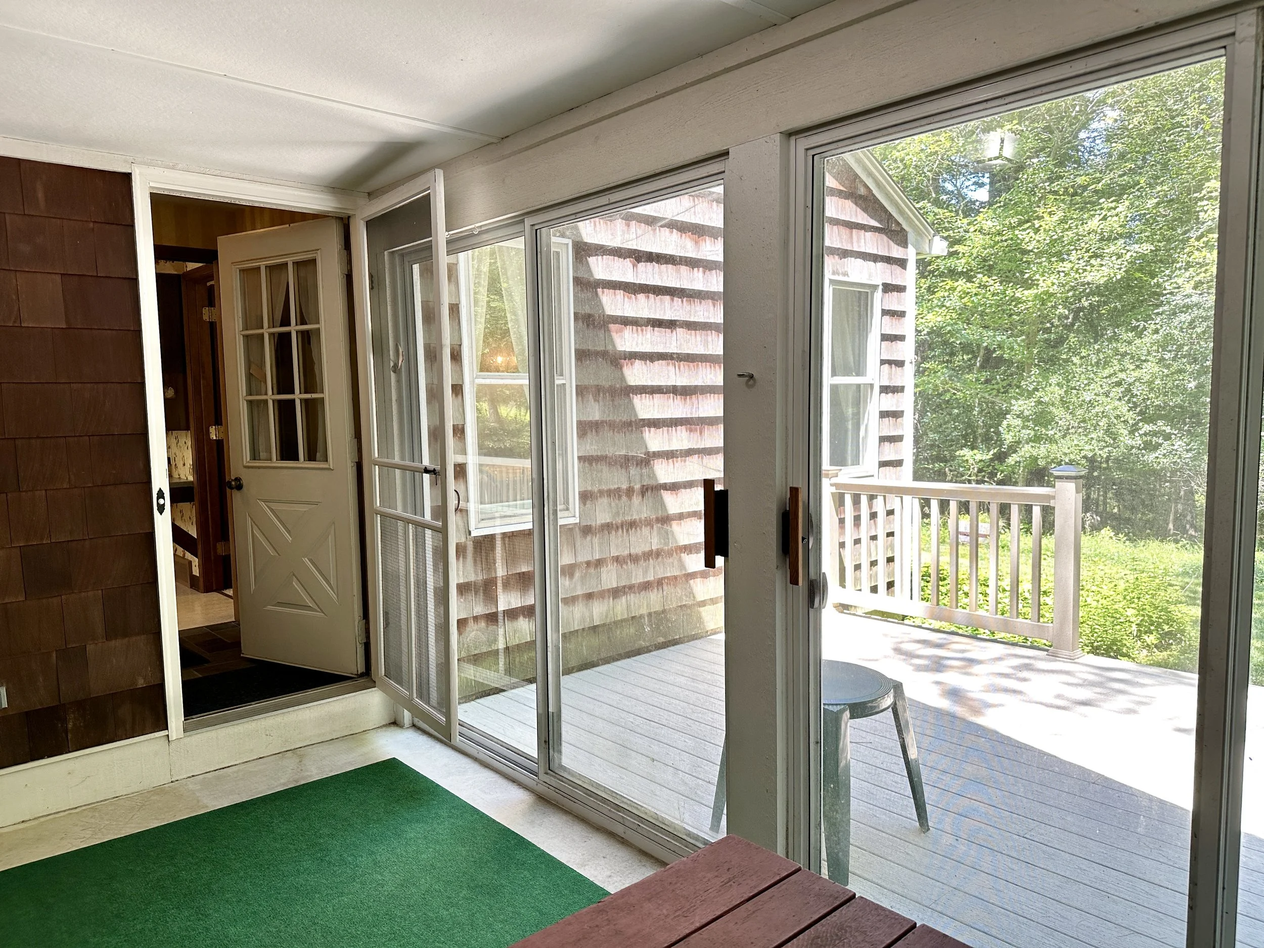 Porch is off the back hall to the kitchen & garage