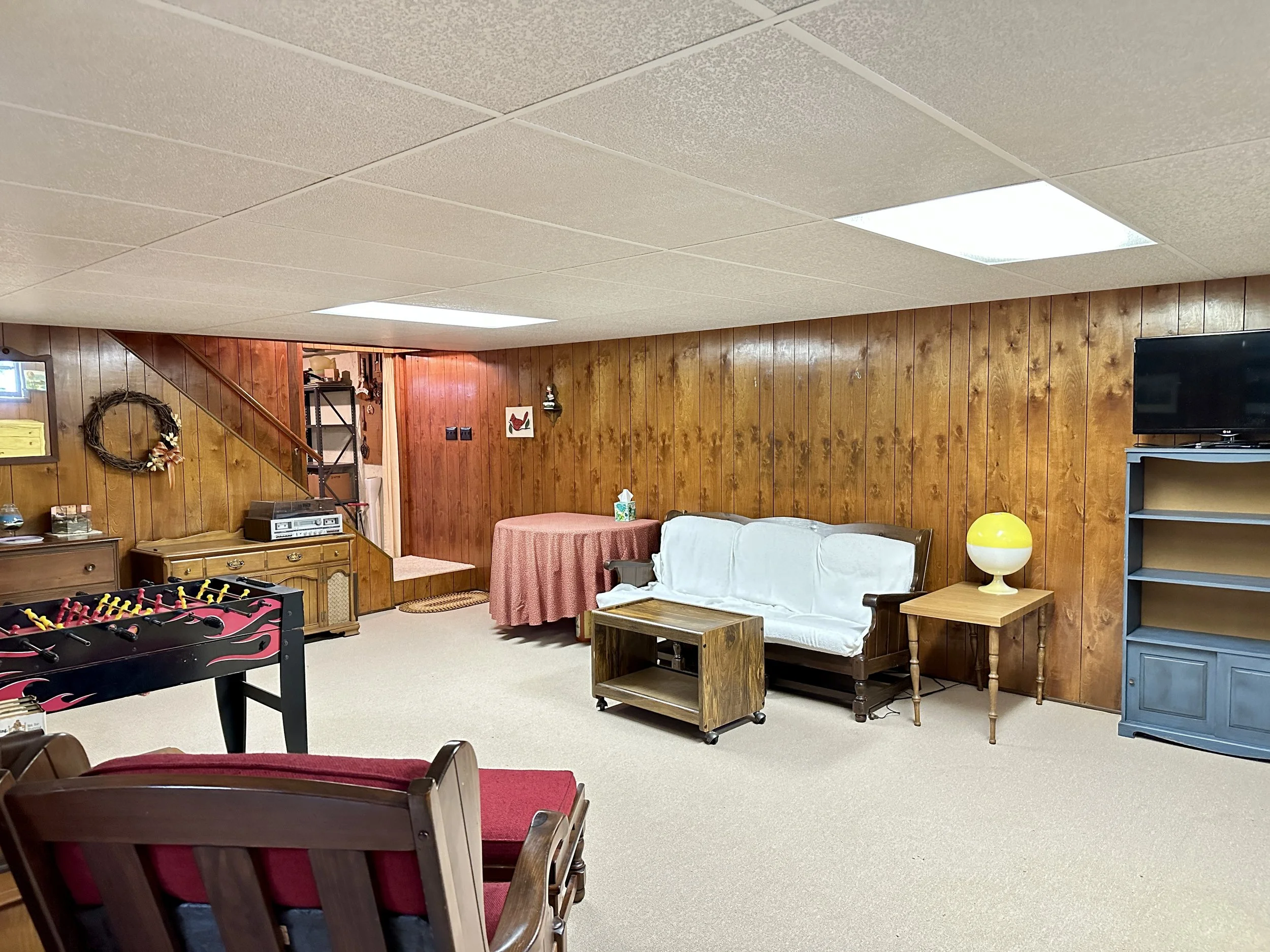 Basement recreation room ideal for movie nights, hobbies, fitness equipment or game-day gatherings.