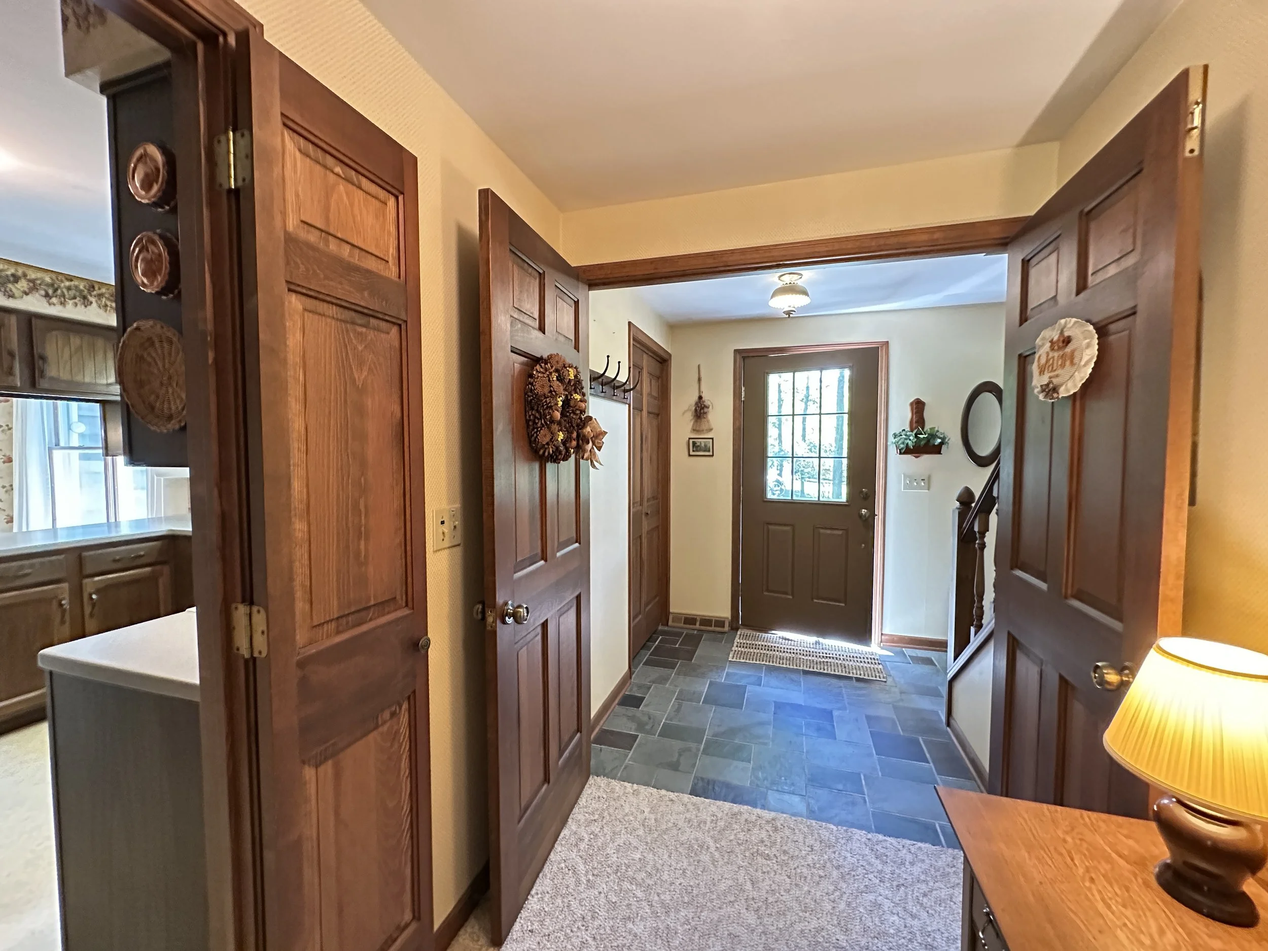 Step inside through the slate-floored foyer
