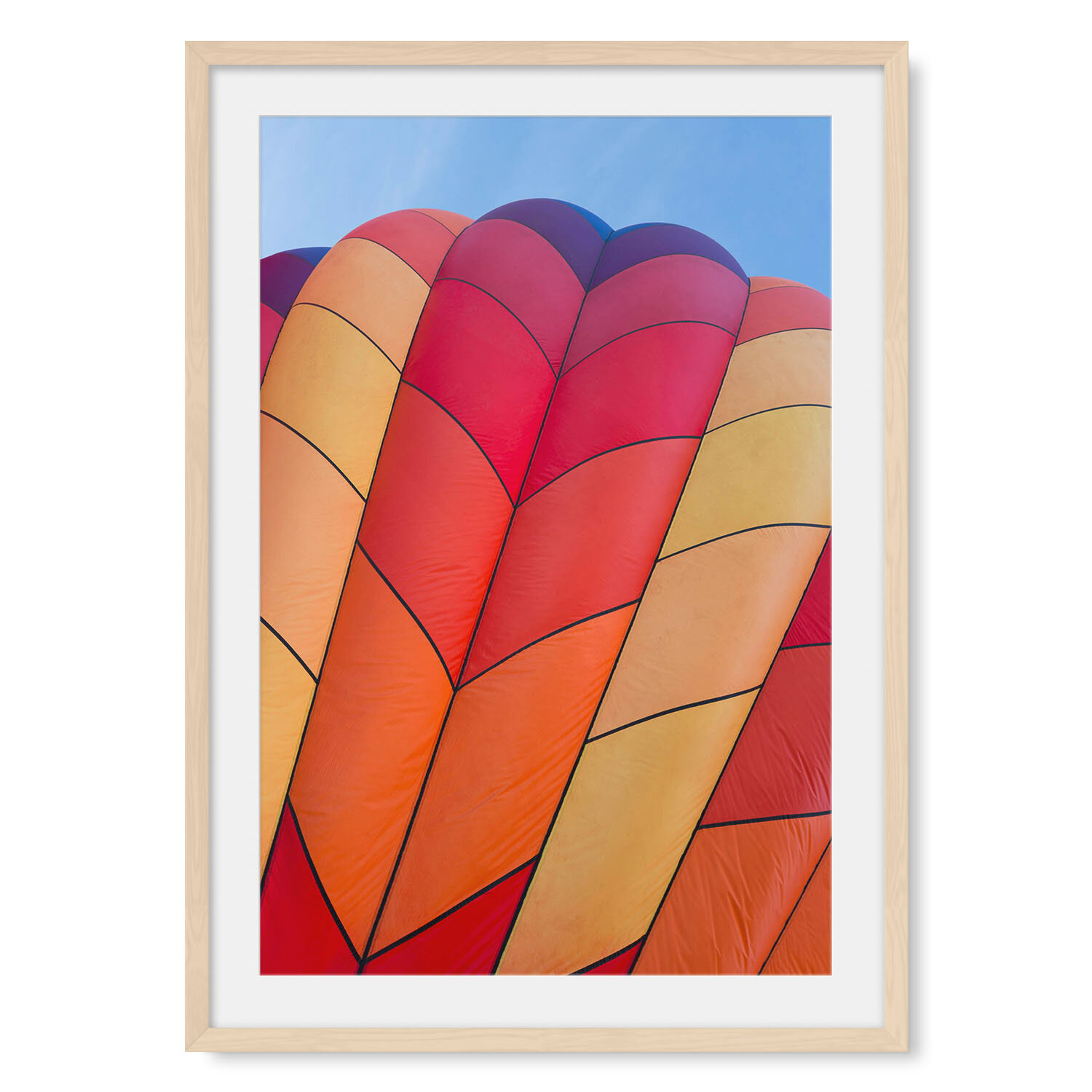 Light maple solid hardwood framed vertical fine art photography of a close up hot air balloon with a red diamond pattern