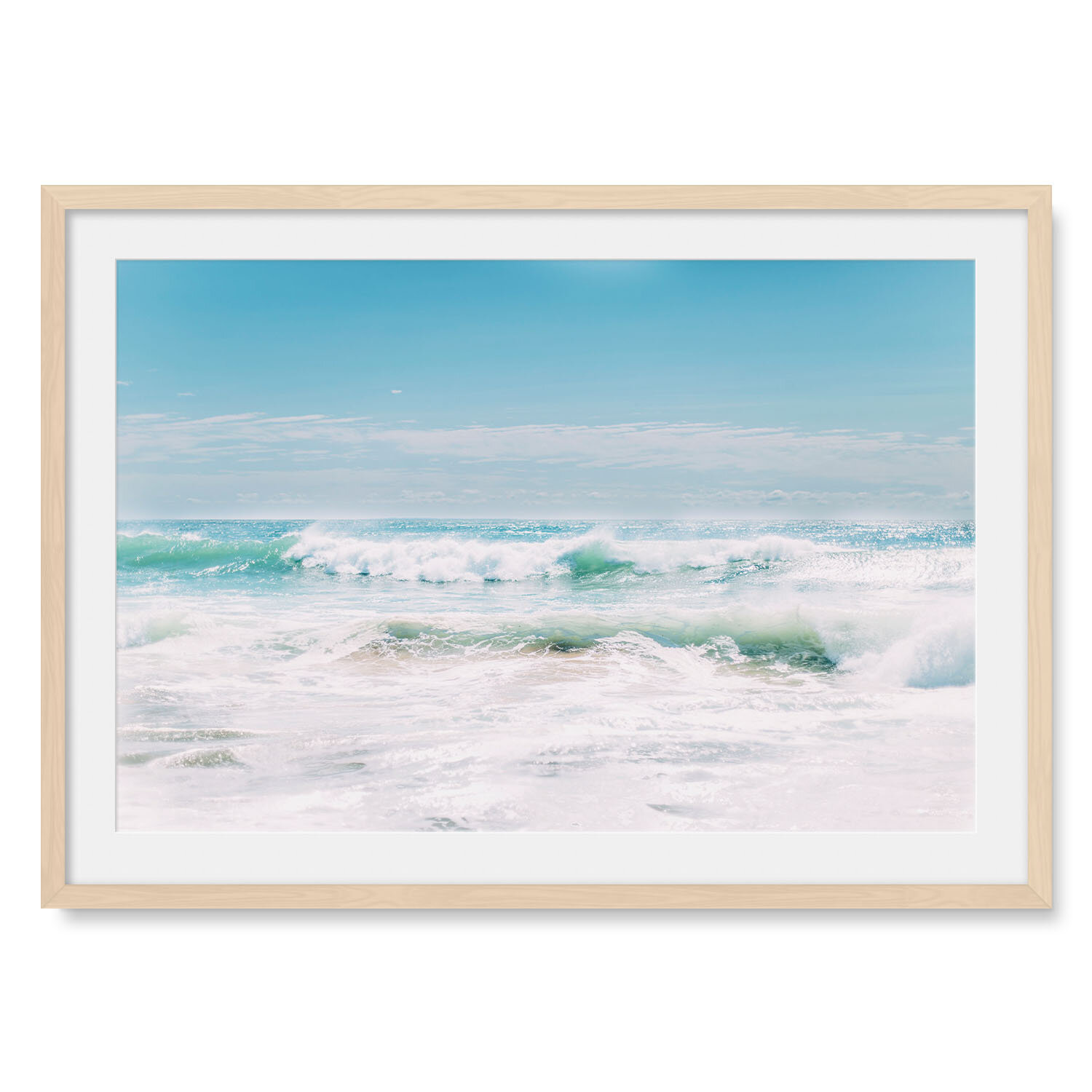 Light maple solid hardwood framed horizontal fine art photography of violent turquoise waves crashing on a white sand beach.