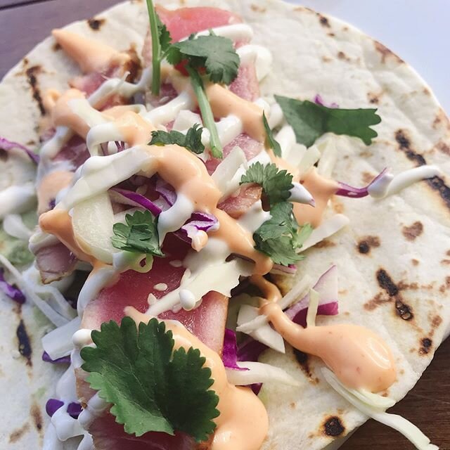 Light, fresh, and authentic food can transform your spirits! This extreme taco close-up features our Seared Ahi Taco with avocado, cabbage, and Wasabi Crema. #balancedlife #fresh #flavors #tacosandtequila #makeagoodday #better #downtownlivingstonmont