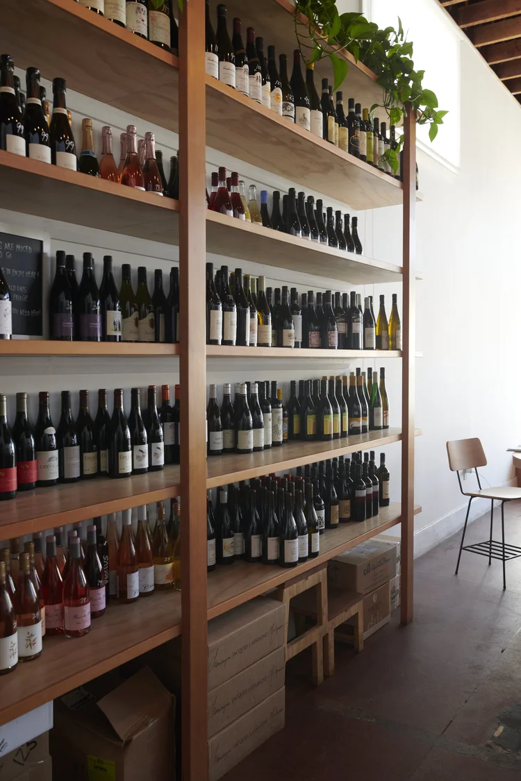 Wine shelf display. Numerous wines on shelf in Palm City bar in San Francisco